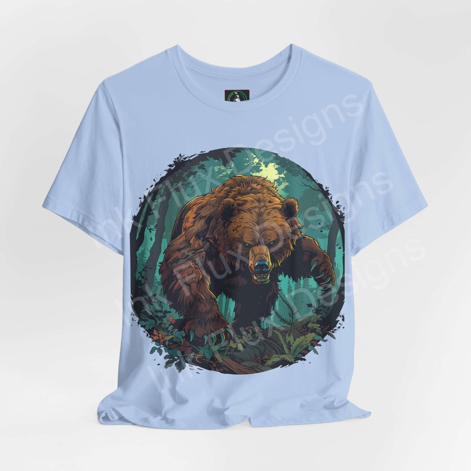 Light blue Kodiak Bear graphic tee showcasing a detailed bear design surrounded by green foliage, ideal for fans of spirit animals and ethically made T-shirts.