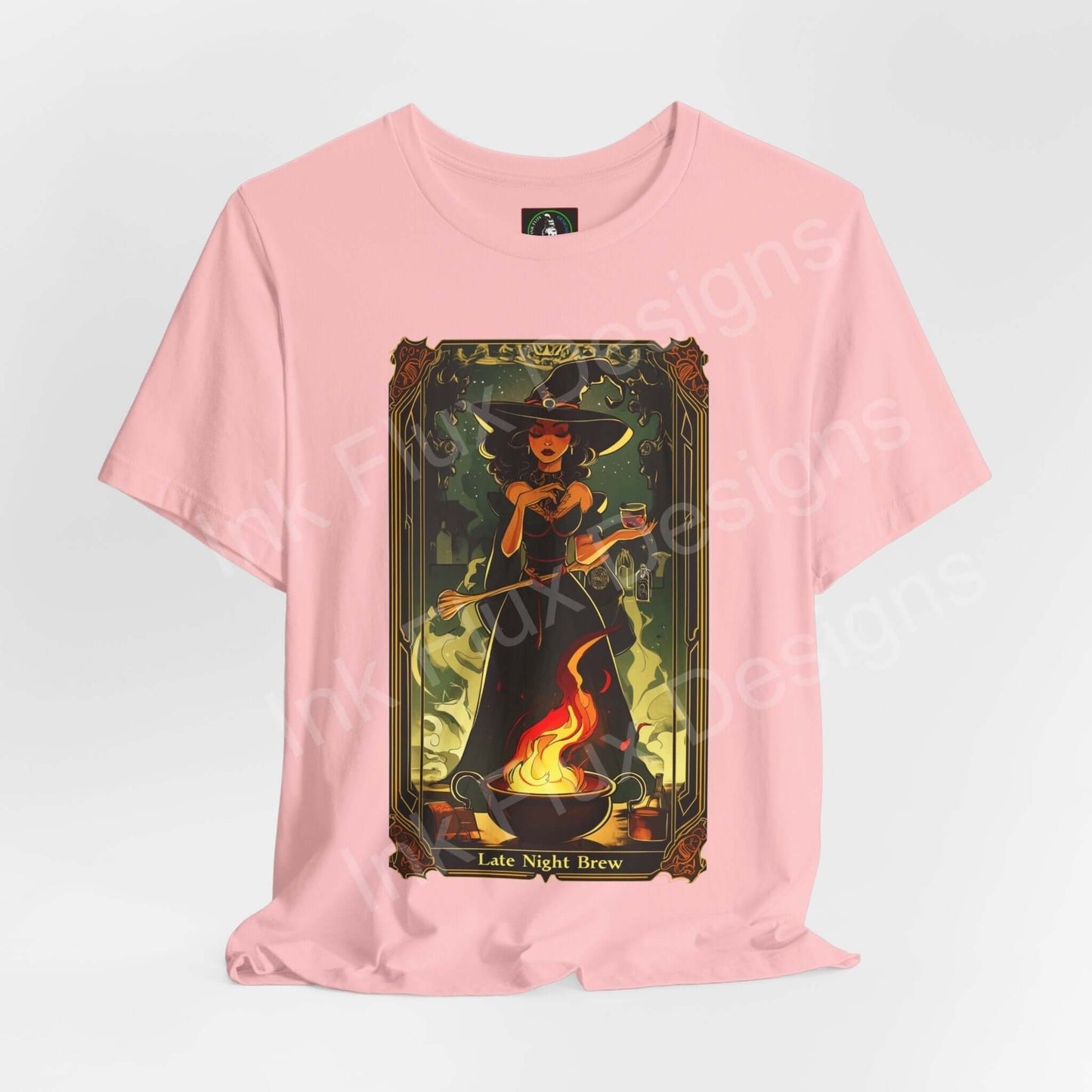 Pink "Late Night Brew" T-shirt featuring a graphic of a witch brewing a potion, crafted from sustainable Airlume cotton, perfect for Halloween.