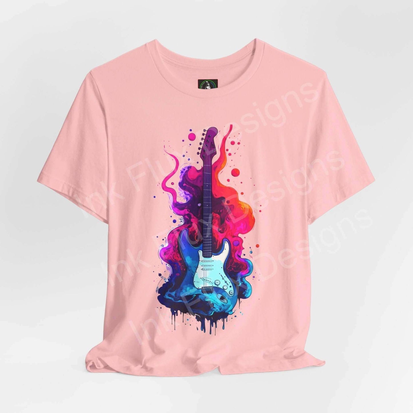 Pink unisex T-shirt featuring a bold graphic design of a colorful splatter-paint guitar on Bella+Canvas jersey fabric.