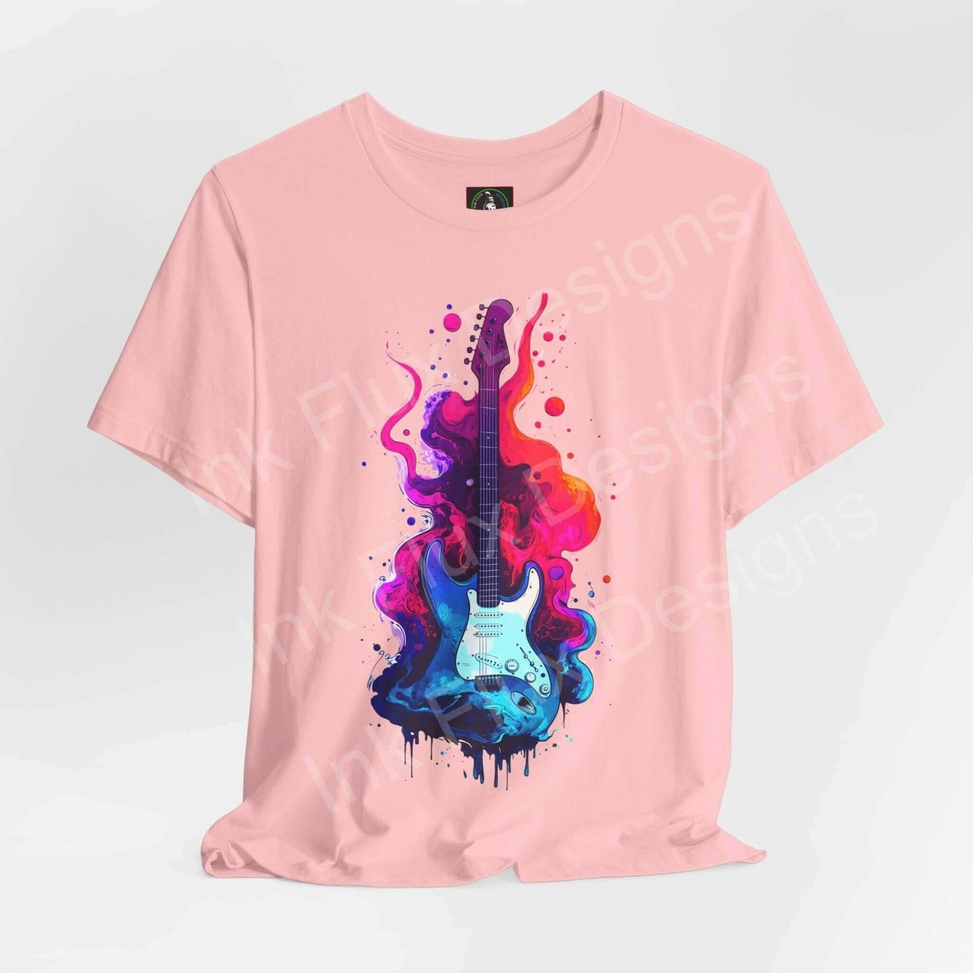 Pink unisex T-shirt featuring a bold graphic design of a colorful splatter-paint guitar on Bella+Canvas jersey fabric.