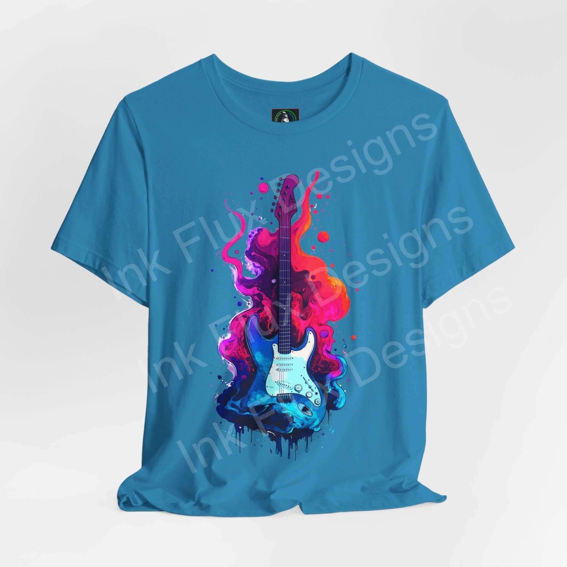 Blue unisex jersey T-shirt featuring bold Liquid Guitar II graphic with vibrant pink and purple splashes, by Bella+Canvas.