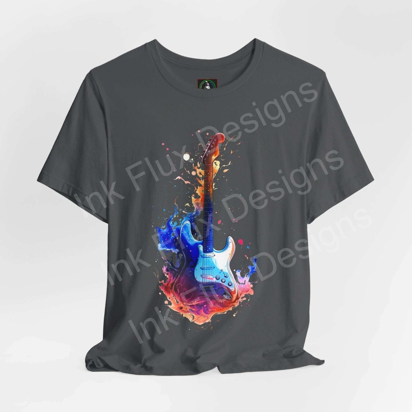 Unisex charcoal gray T-shirt featuring a vibrant graphic of a guitar emerging from colorful paint splashes, combining style and bold graphics.