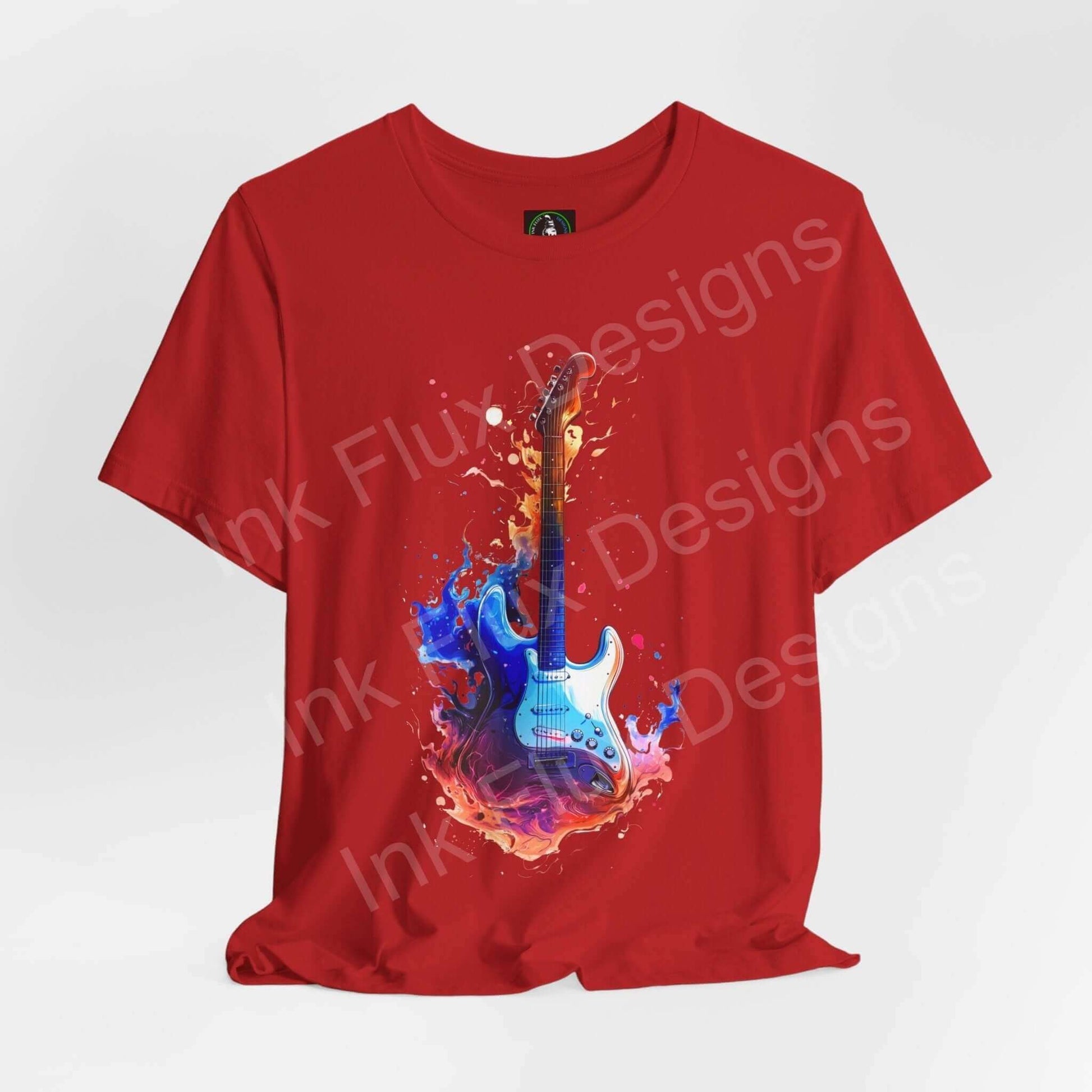 Red unisex jersey T-shirt featuring a bold graphic of a blue guitar with vibrant liquid splash design, crafted from soft Airlume cotton.