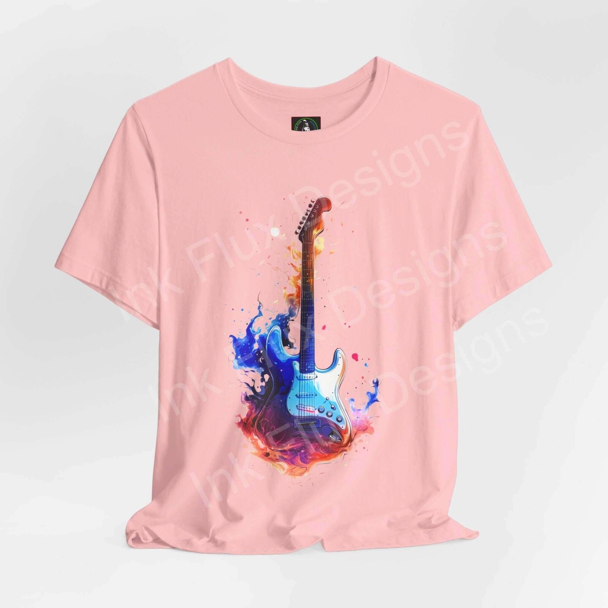 Pink unisex jersey T-shirt featuring a bold graphic of a blue guitar with colorful paint splashes, ideal for music and fashion enthusiasts.