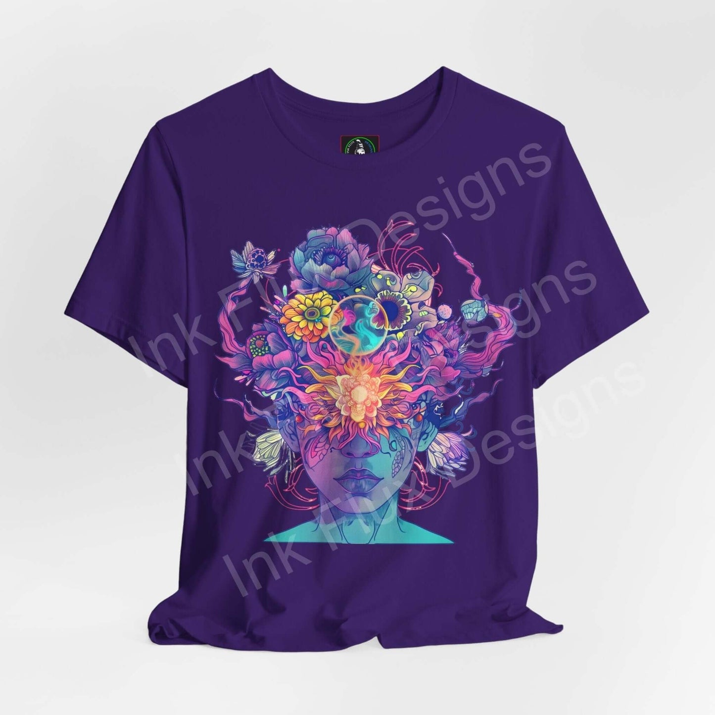 Unisex purple T-shirt featuring a vibrant, psychedelic graphic of a floral and abstract design on the front, from Bella+Canvas