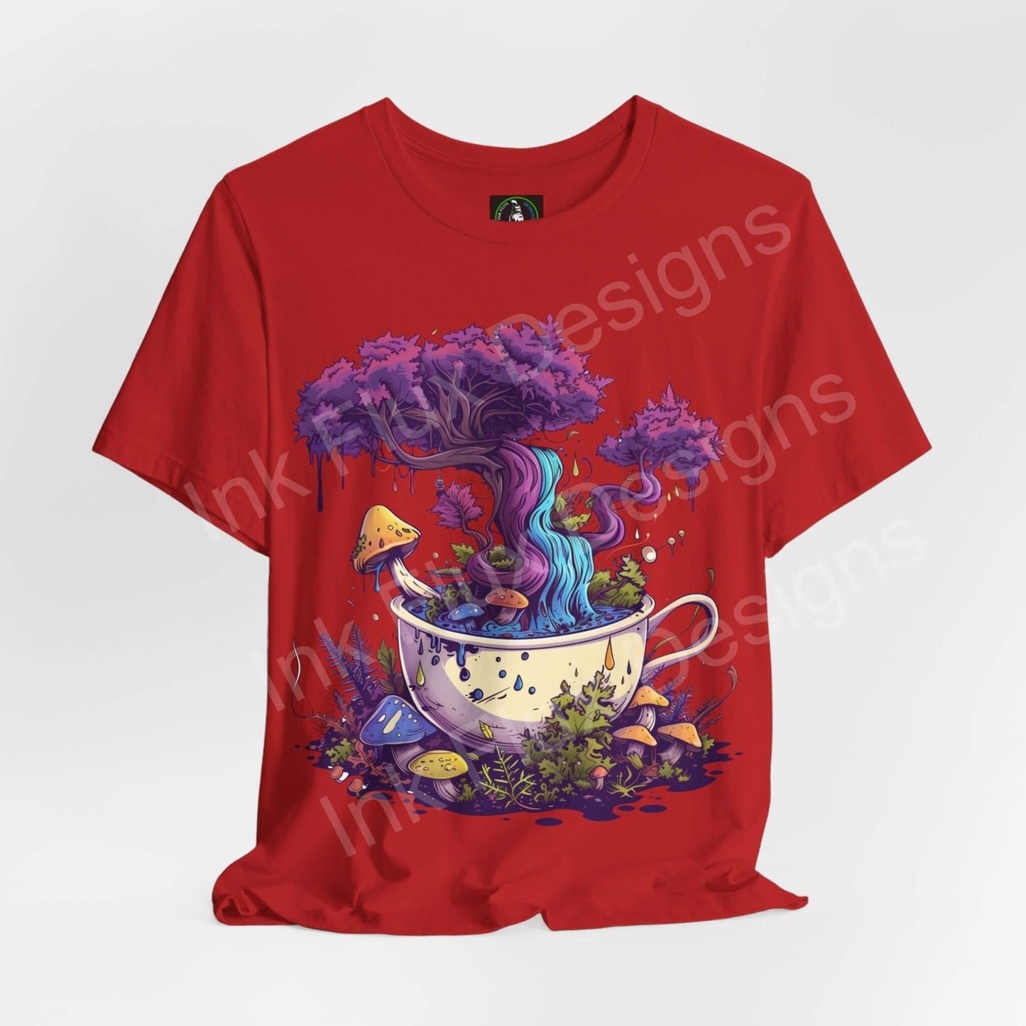 Red 'Magical Brew II' unisex T-shirt featuring a trippy, psychedelic graphic of a tree and swirls emerging from a teacup, designed by Bella+Canvas.