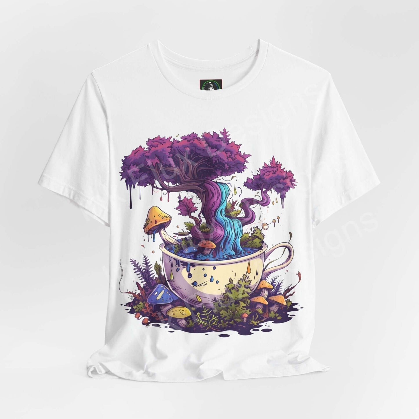 Unisex white T-shirt featuring a psychedelic graphic of a colorful tree growing from a teacup, surrounded by mushrooms and foliage, from the Magical Brew II collection.