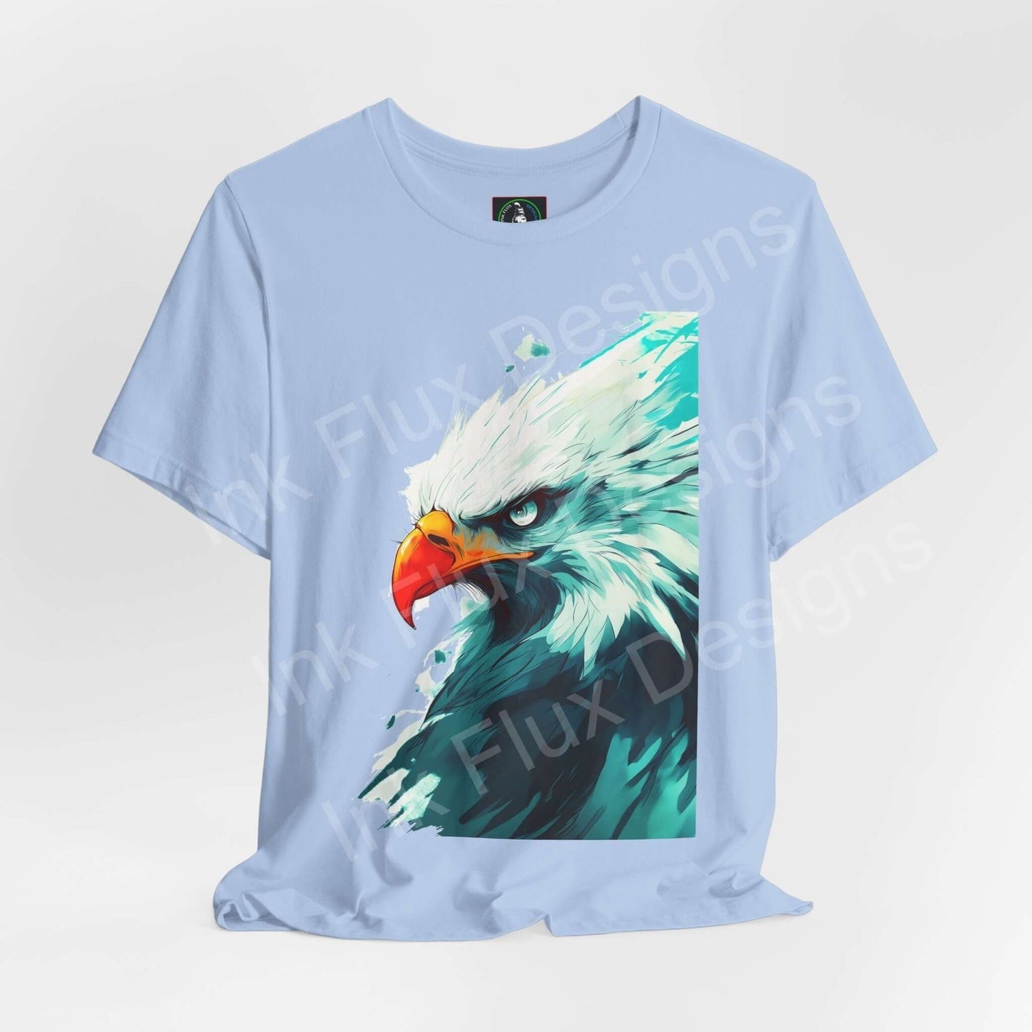 Light blue unisex T-shirt featuring a graphic of a mighty bald eagle, ideal for those who admire spirit animals and stylish, comfortable apparel.