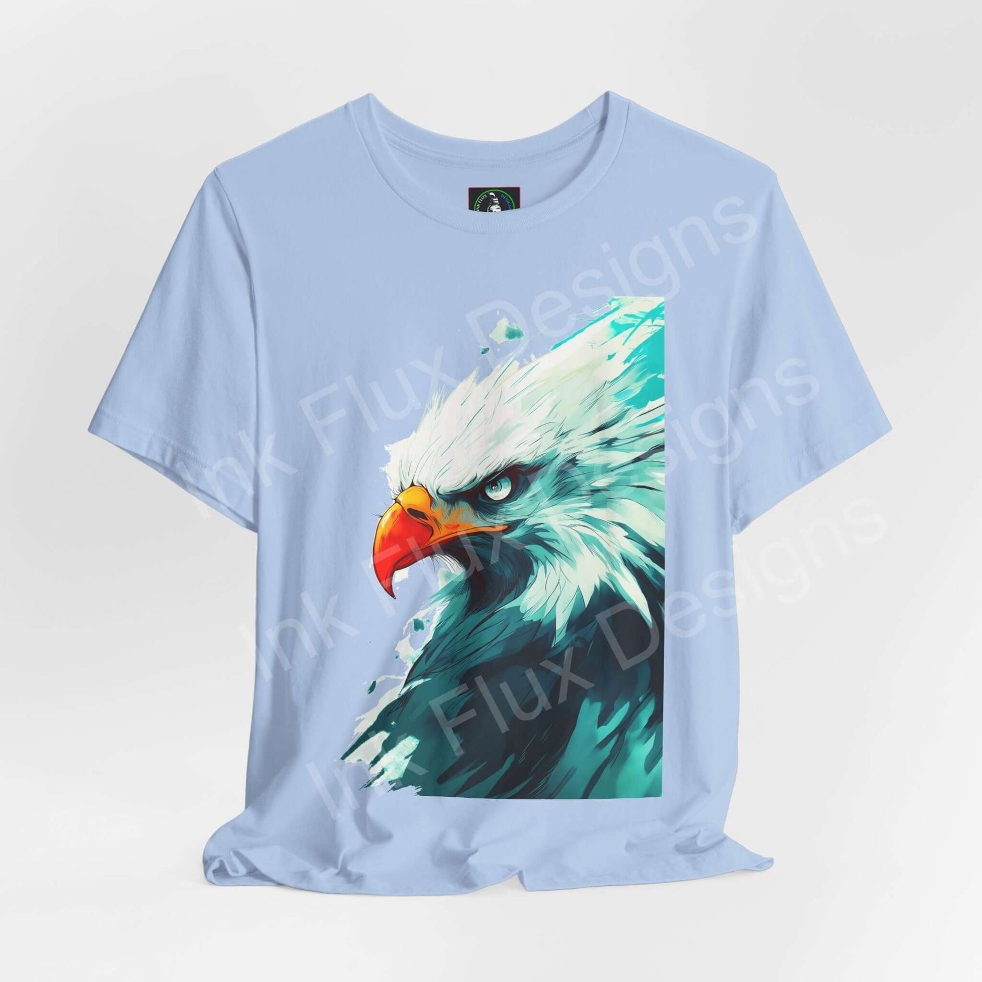 Light blue unisex T-shirt featuring a graphic of a mighty bald eagle, ideal for those who admire spirit animals and stylish, comfortable apparel.