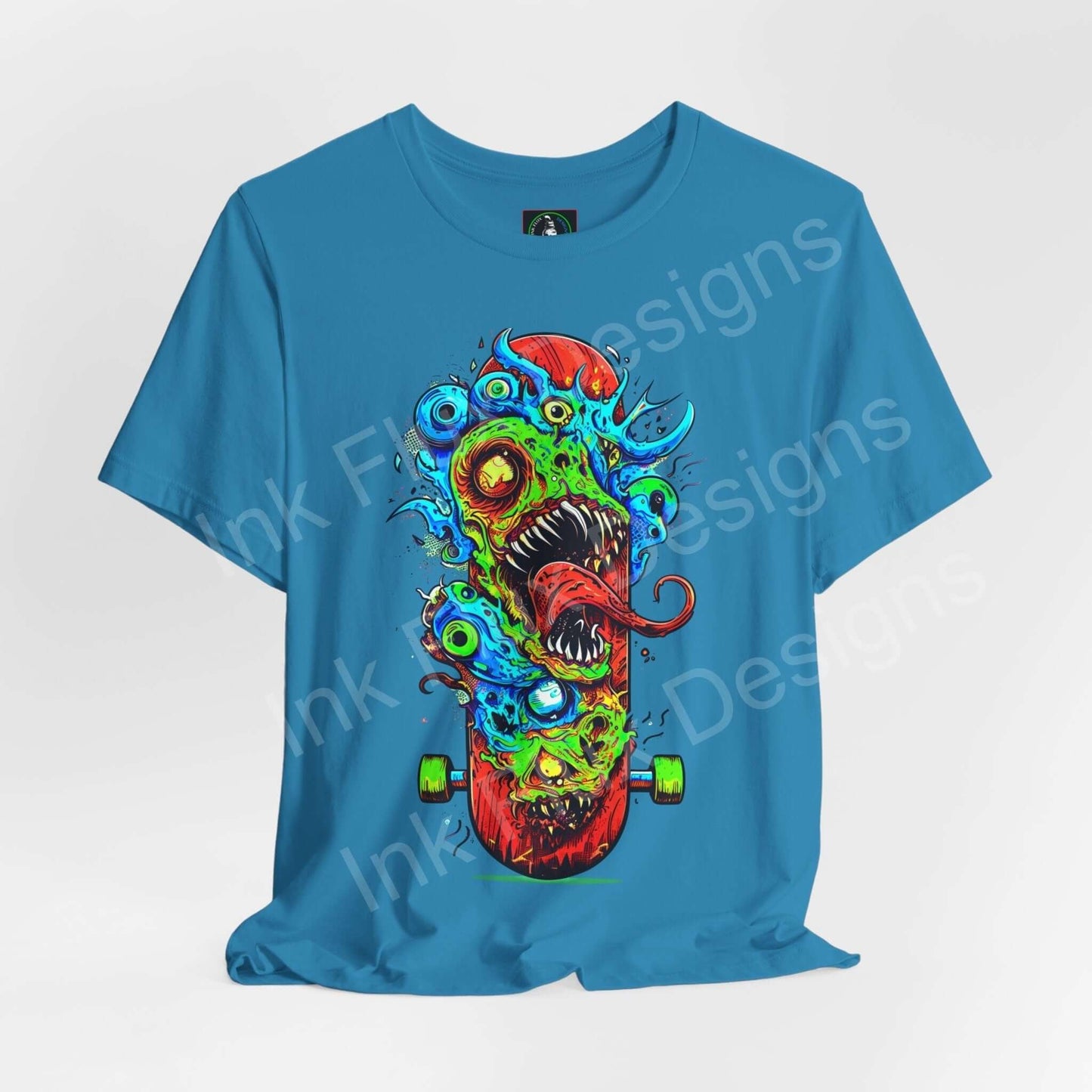 Bold graphic tee featuring a colorful monster skateboard design on a blue unisex jersey T-shirt by Bella+Canvas