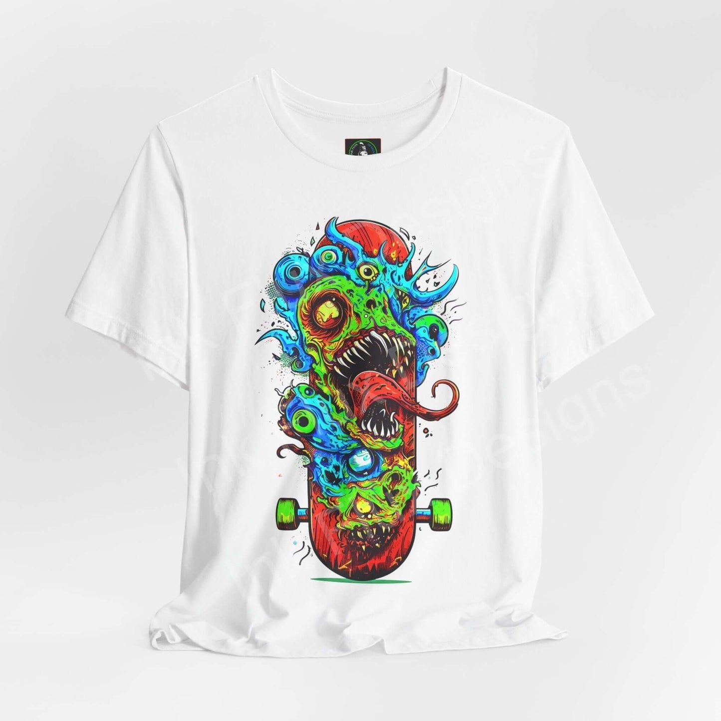 White unisex T-shirt featuring a bold graphic of a colorful monster skateboard design, crafted by Bella+Canvas for style and comfort.