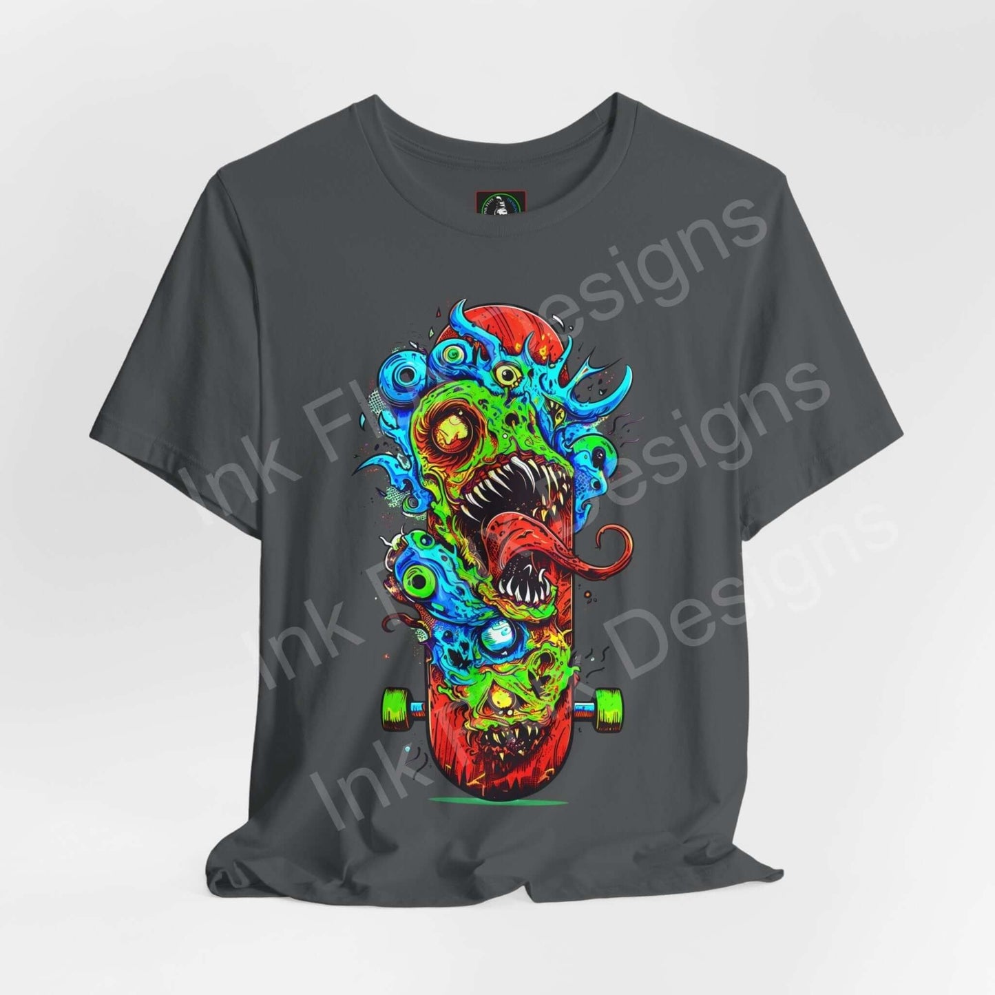Bold graphic tee featuring a colorful monster skateboard design on a gray unisex jersey T-shirt by Bella+Canvas.