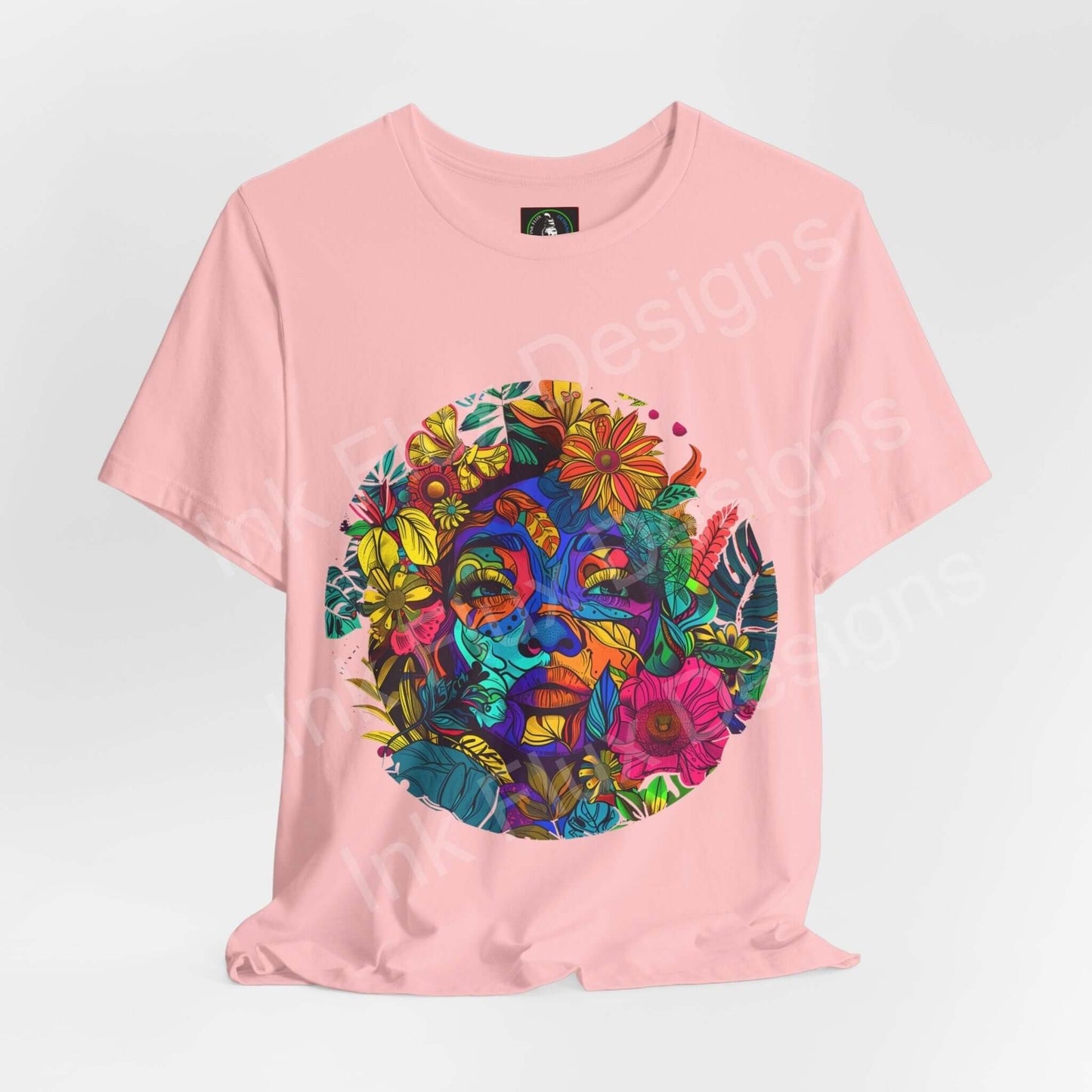 Pink unisex T-shirt with a bold psychedelic graphic featuring vibrant, trippy floral and face motifs, ideal for a standout look.