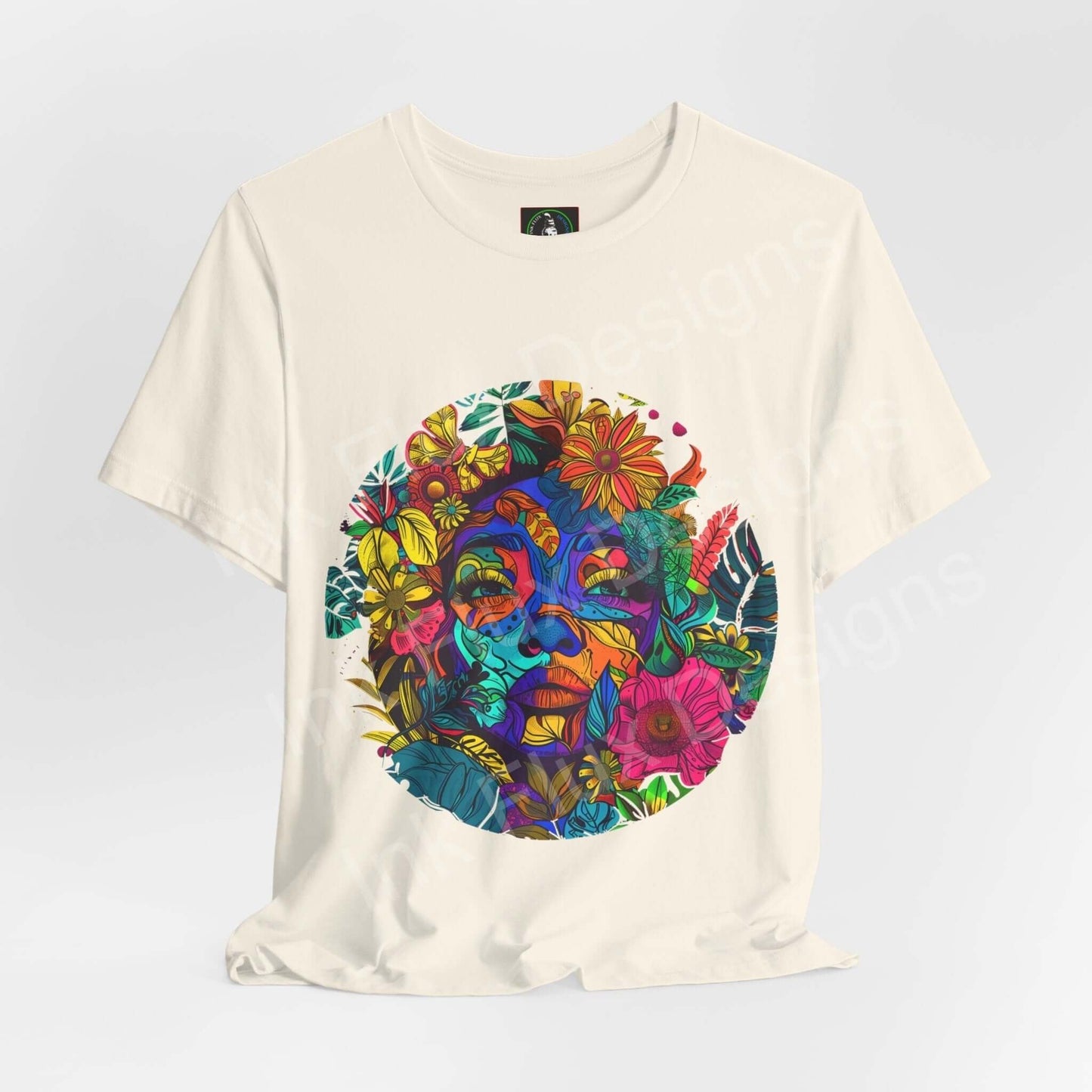 Unisex cream-colored jersey T-shirt featuring a vibrant, psychedelic Mother Earth graphic with bold floral and facial patterns, perfect for any occasion.