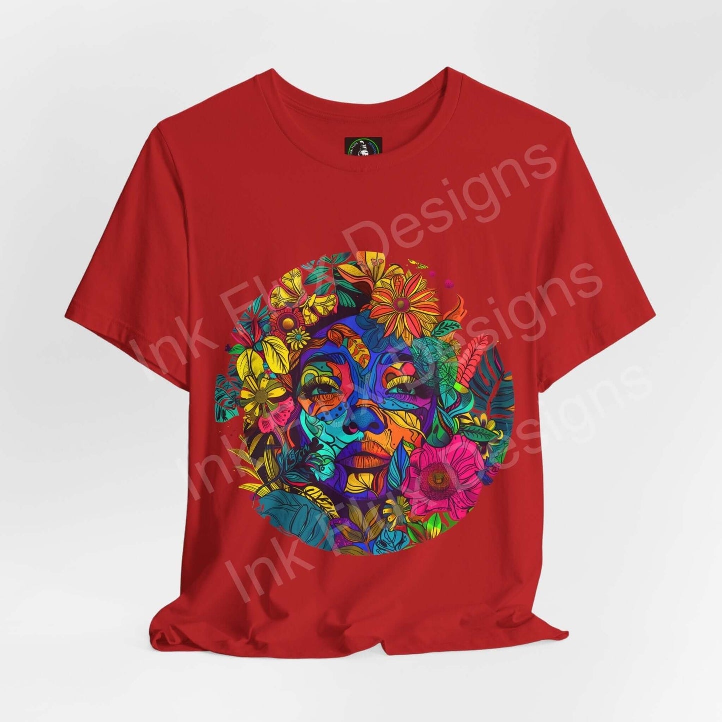 Red unisex T-shirt featuring a bold, psychedelic graphic of Mother Earth with vibrant floral patterns, crafted by Bella+Canvas for style and sustainability.