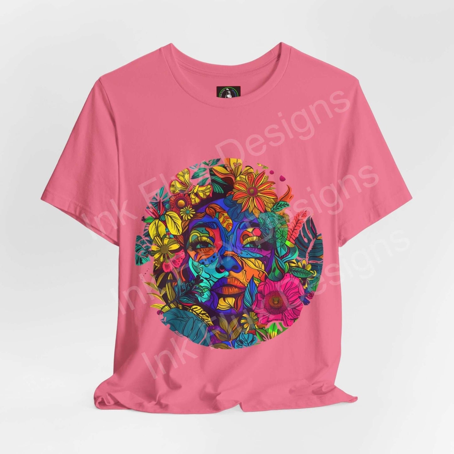 Pink unisex T-shirt featuring a bold, psychedelic graphic of Mother Earth with vibrant, trippy floral designs, crafted by Bella+Canvas for style and sustainability.