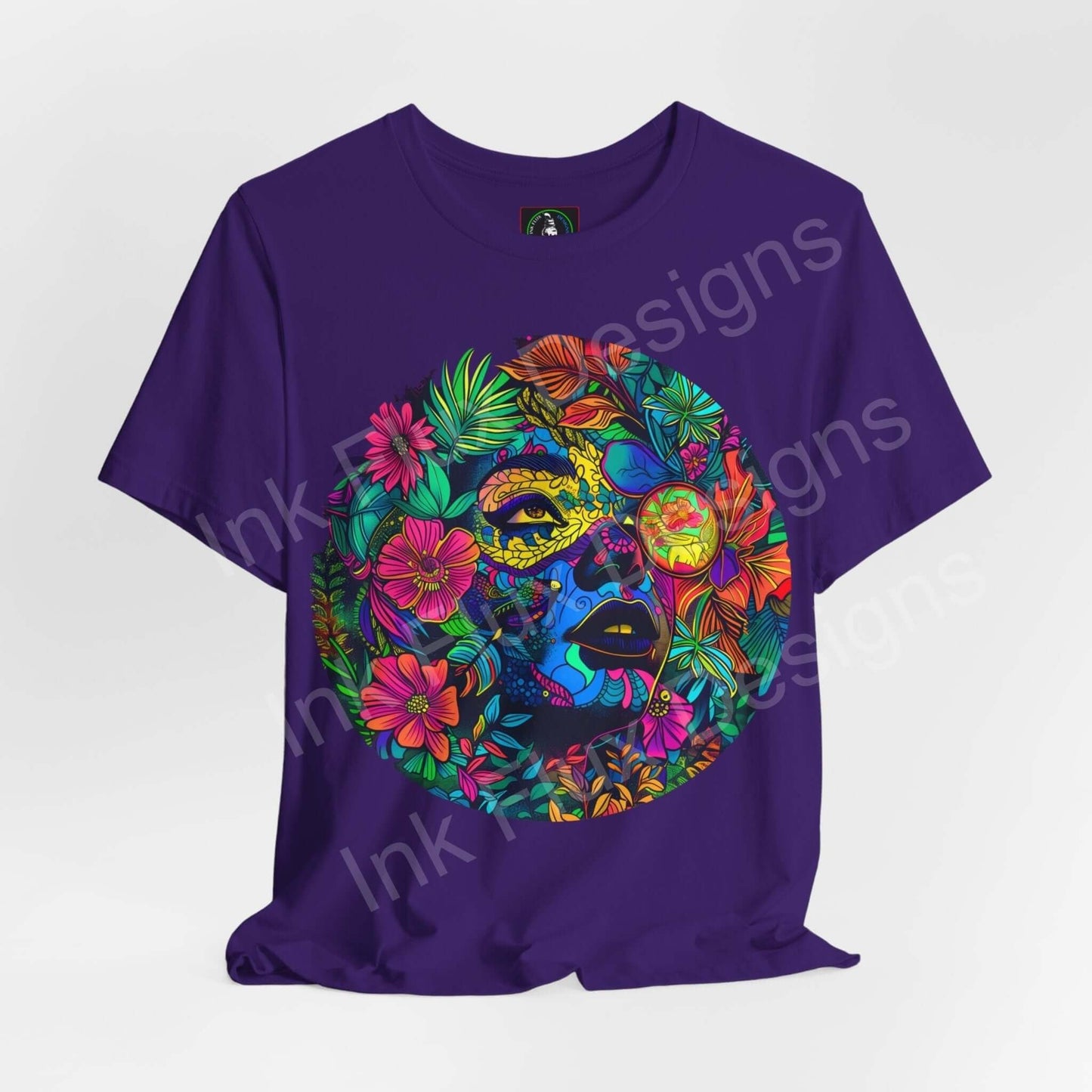 Purple unisex T-shirt featuring a bold, psychedelic graphic with colorful floral patterns and a trippy face design, by Bella+Canvas.