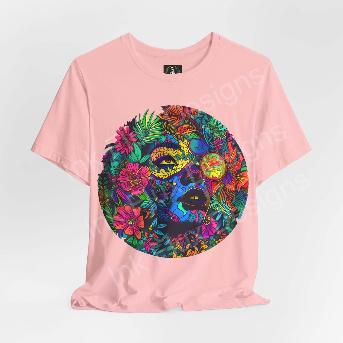 Pink unisex T-shirt featuring a bold, psychedelic graphic with vibrant floral designs and a trippy face motif, from the Mother Earth II collection by Bella+Canvas.