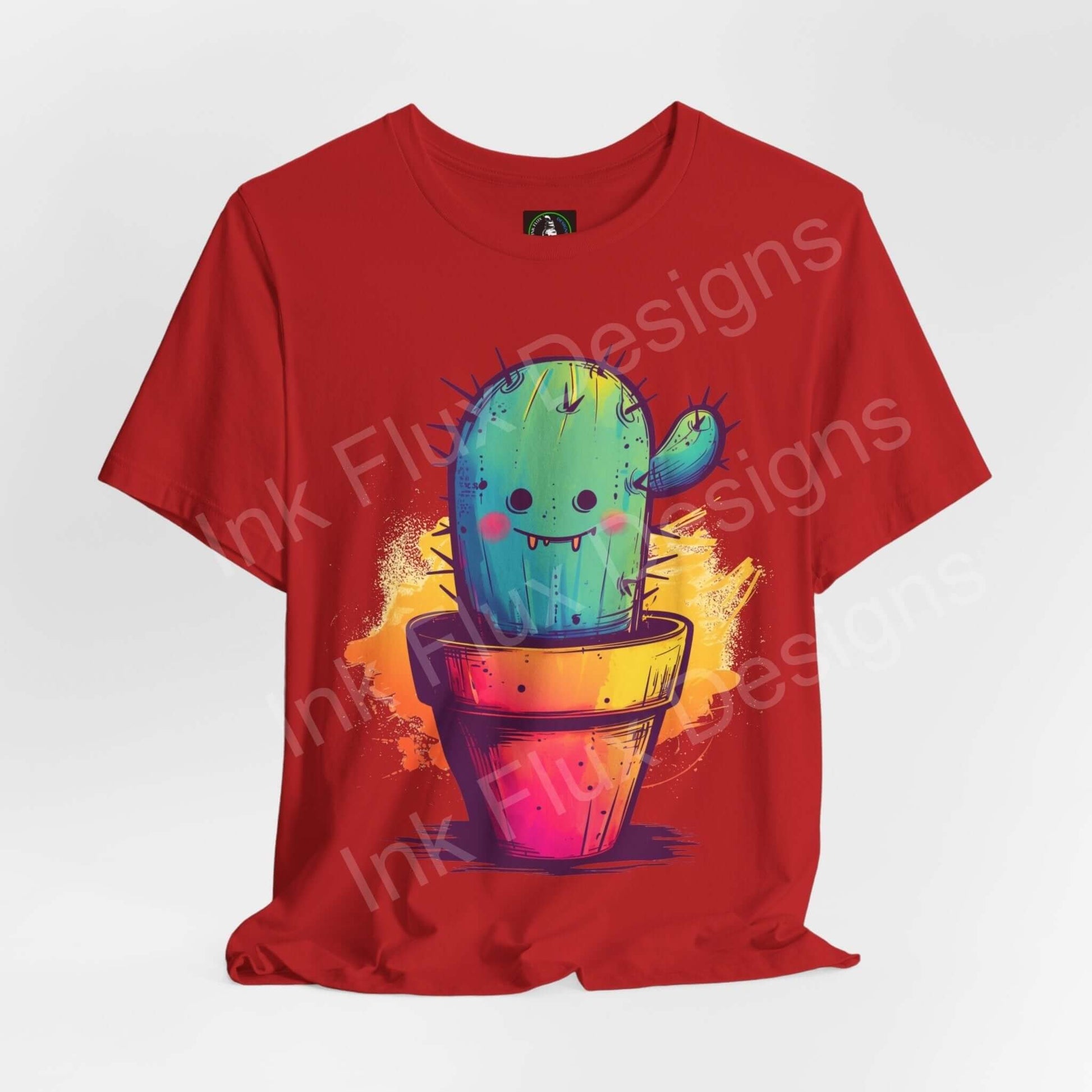 Red unisex T-shirt with a vibrant graphic of a smiling cactus in a colorful pot, showcasing bold, artistic design on breathable cotton fabric.