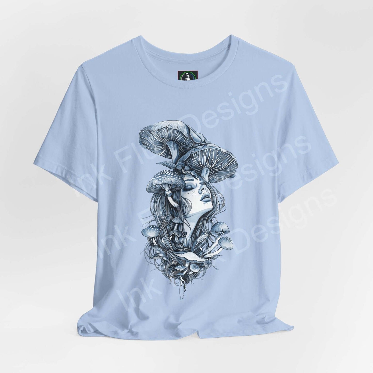 Light blue unisex T-shirt featuring a bold, trippy graphic of a woman with mushroom motifs, embodying a psychedelic style.