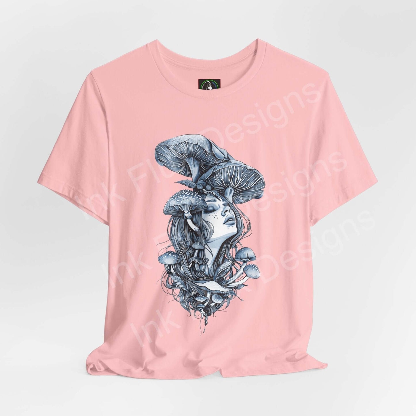 Pink unisex T-shirt featuring bold graphic of a woman with mushroom cap design, trippy and psychedelic style by Bella+Canvas.
