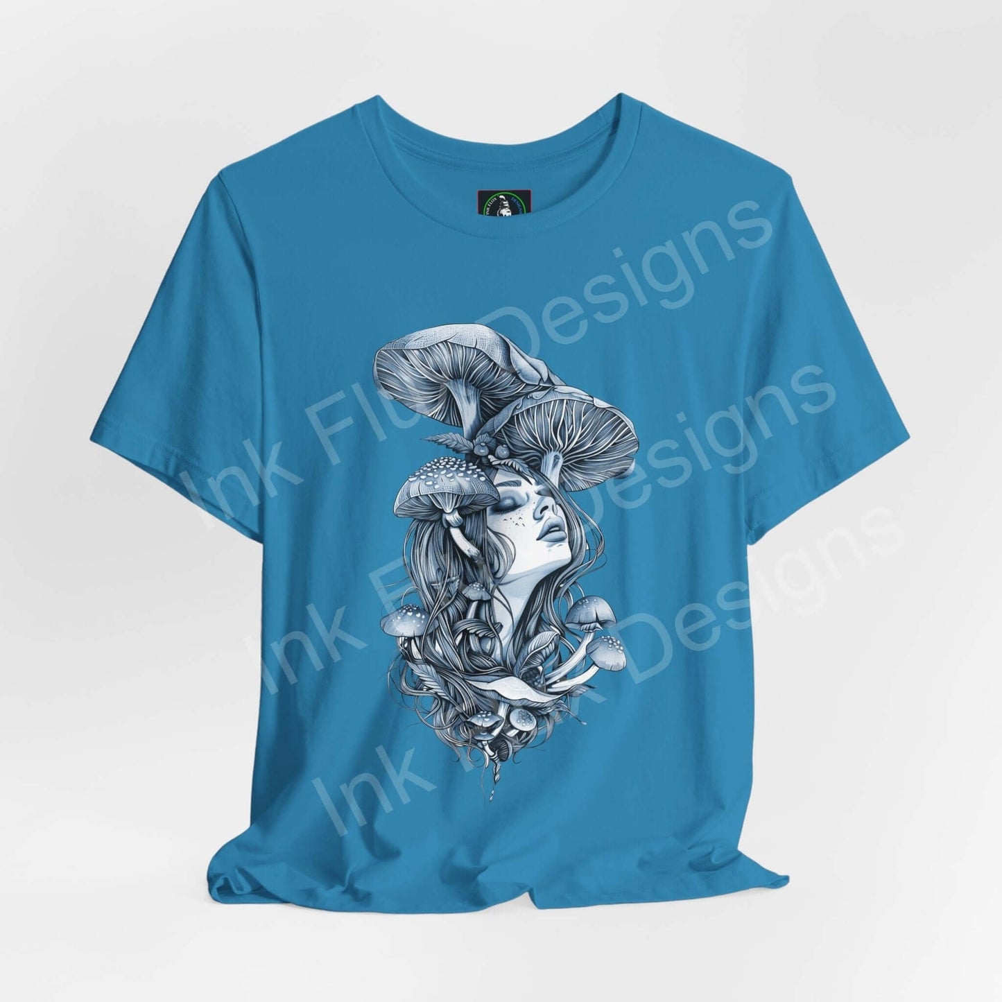 Psychedelic blue T-shirt featuring trippy graphic of a woman with mushroom design, from the Mushroom Lady III collection by Bella+Canvas.