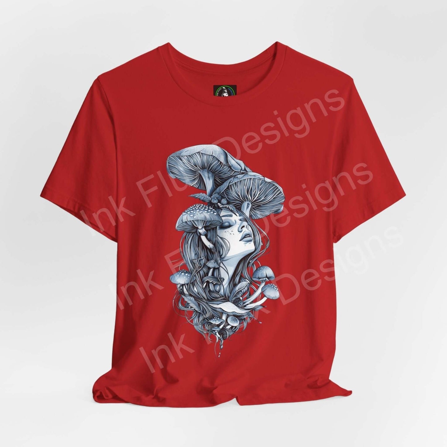 Red unisex t-shirt featuring bold, trippy graphic of a woman with mushrooms as hair, showcasing psychedelic design on breathable cotton fabric.