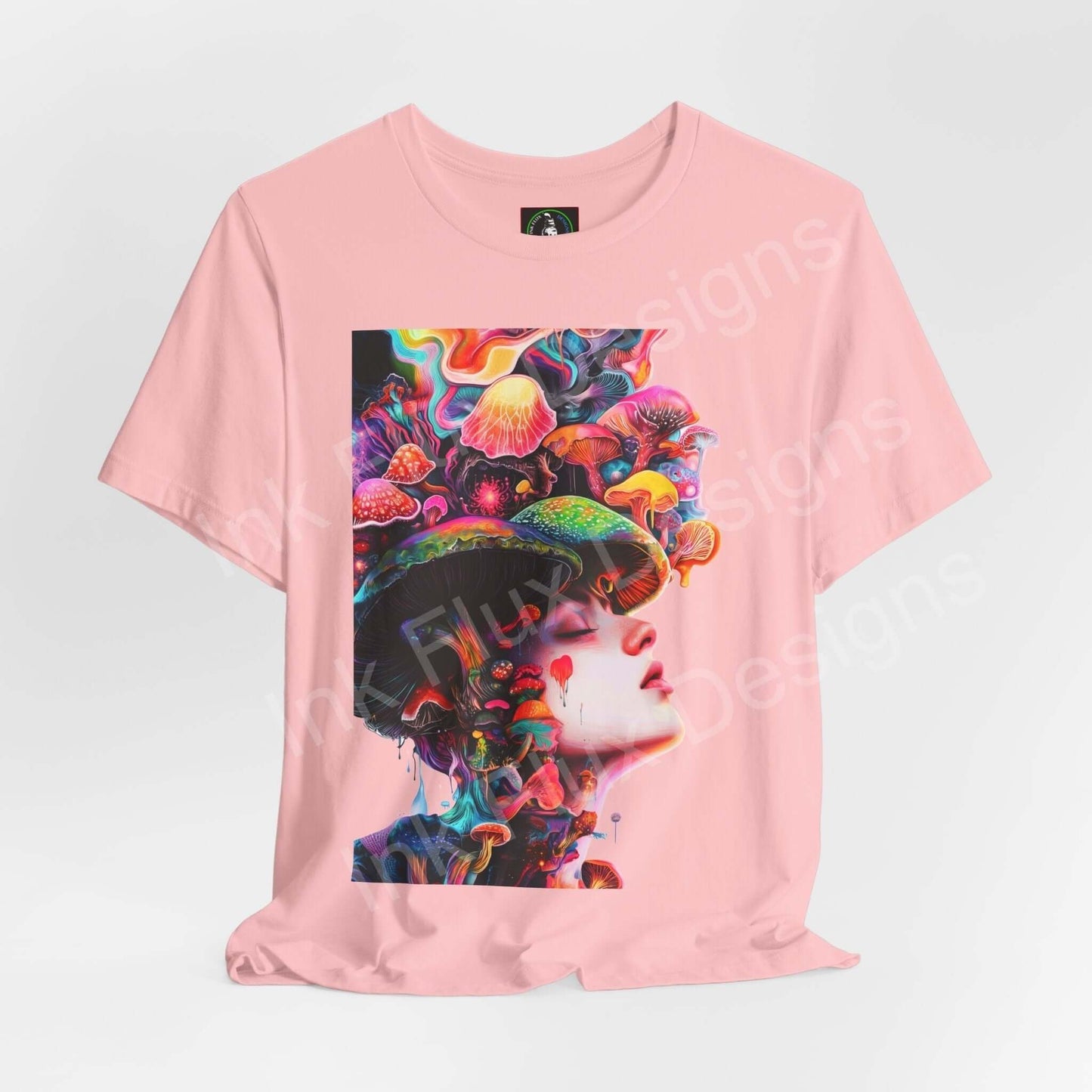 Pink unisex T-shirt featuring bold, psychedelic graphic of a face adorned with vibrant mushrooms, ideal for fans of trippy and graphic tees.