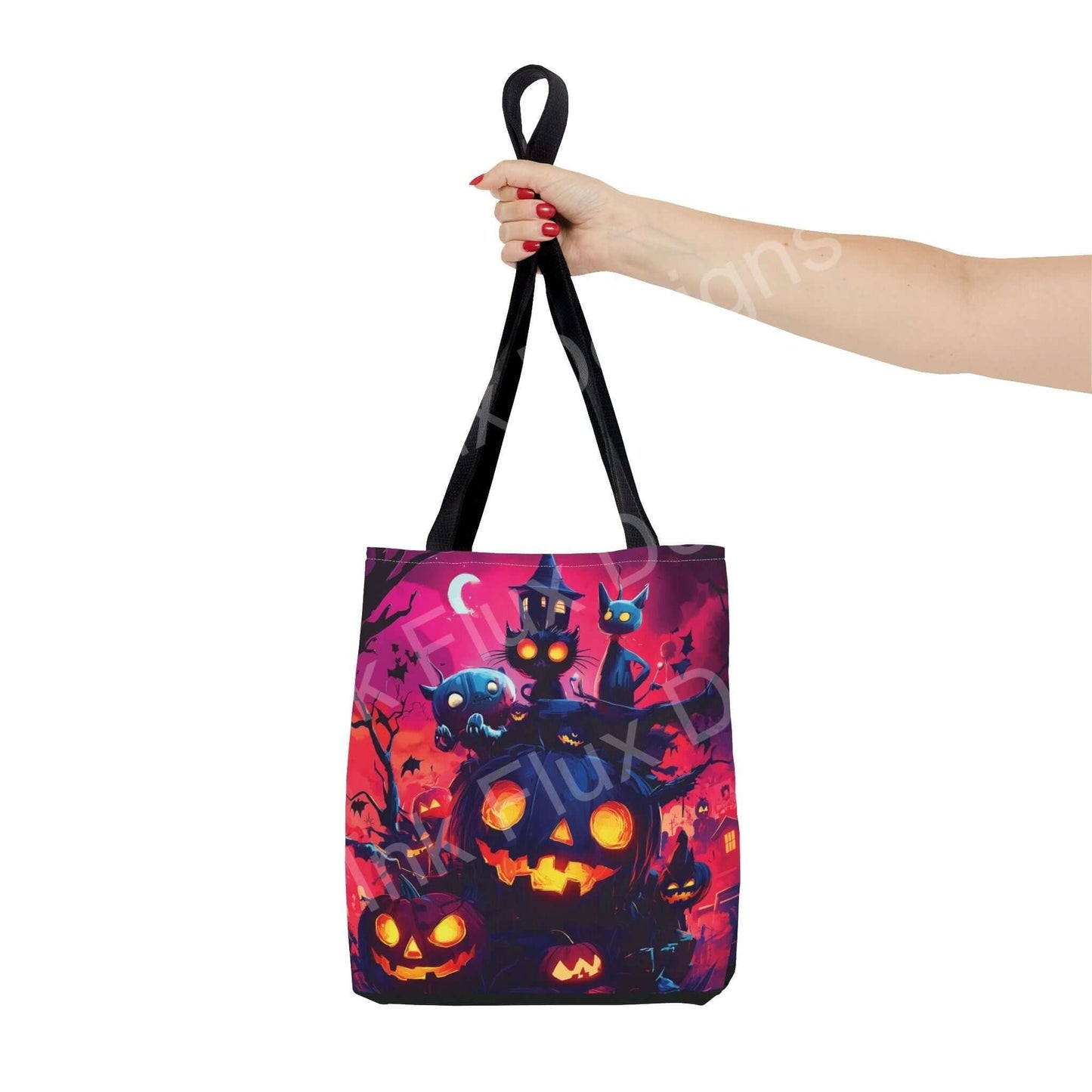 Hand holding a Night Jack o' lanterns Tote Bag featuring colorful all-over print with spooky pumpkins and cats, ideal for Halloween.