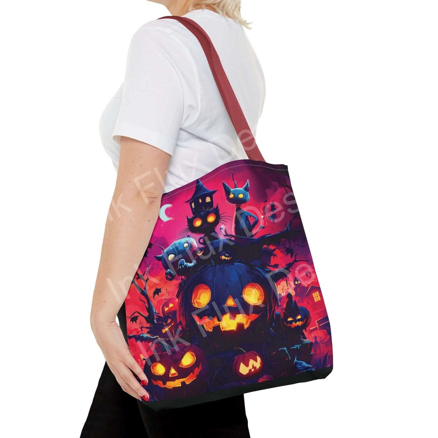 Woman carrying a Night Jack o' lanterns tote bag with vibrant Halloween-themed all-over print design and red strap