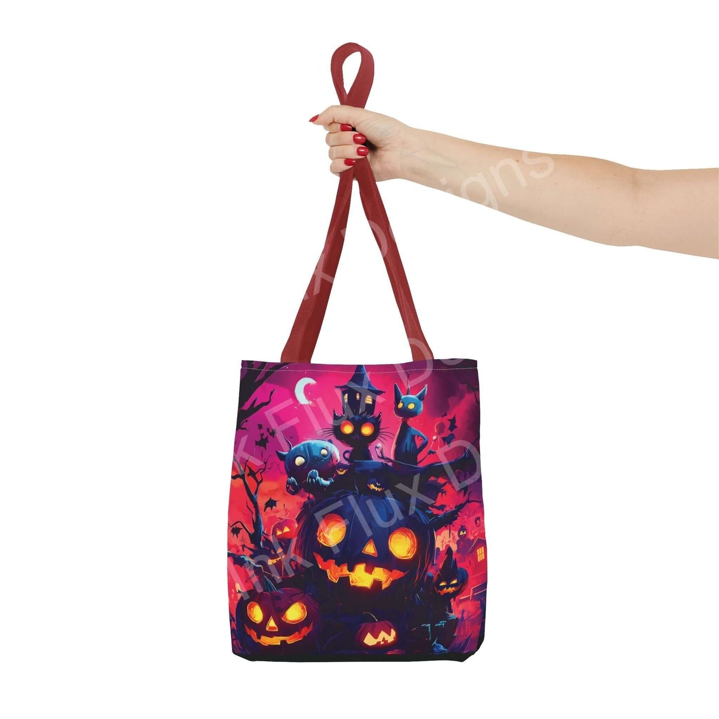Woman's hand holding a vibrant Night Jack o' Lanterns Tote Bag with colorful all-over Halloween theme print and red straps.