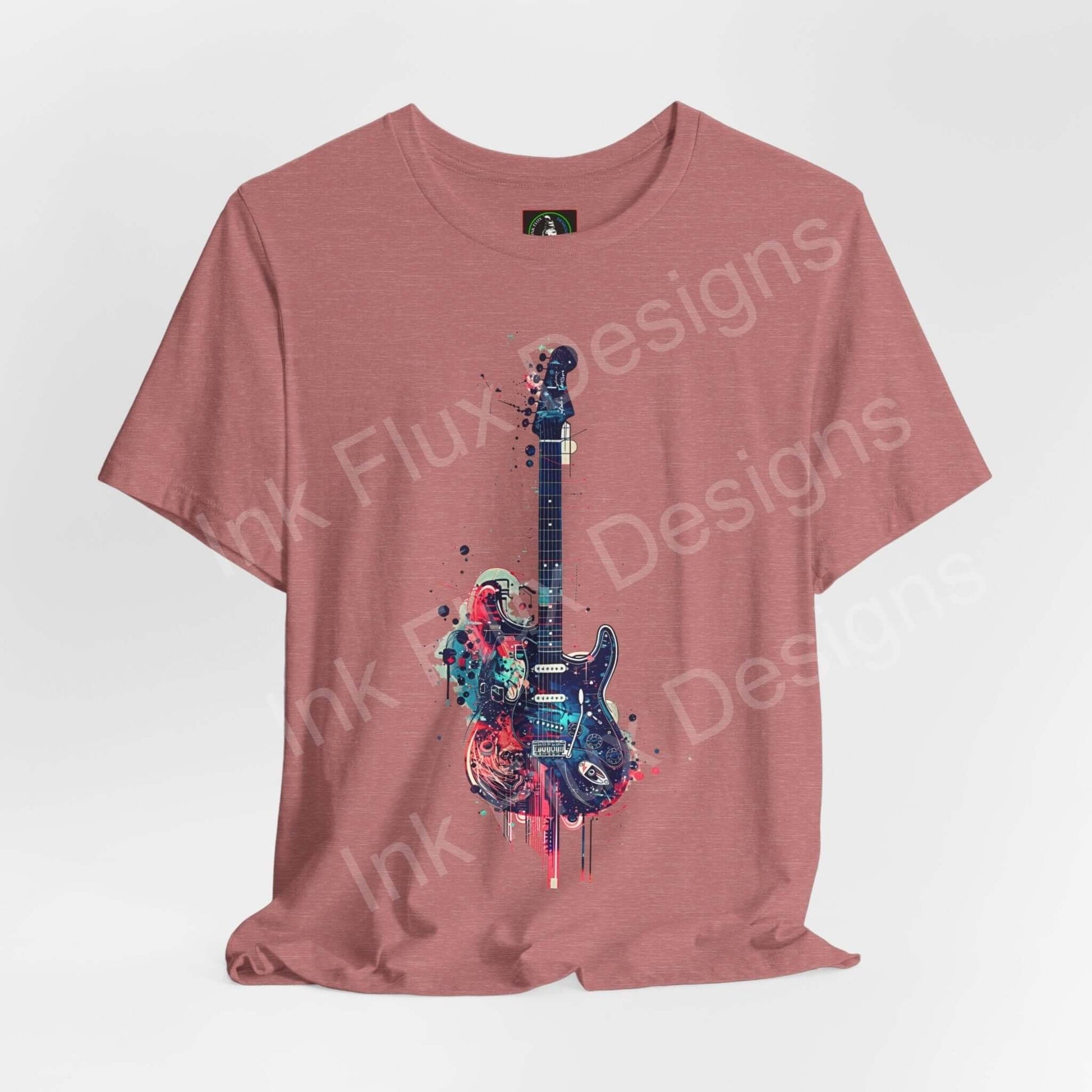 Unisex rose-colored jersey T-shirt featuring a bold graphic of a paint-splattered guitar, crafted by Bella+Canvas for style and comfort.