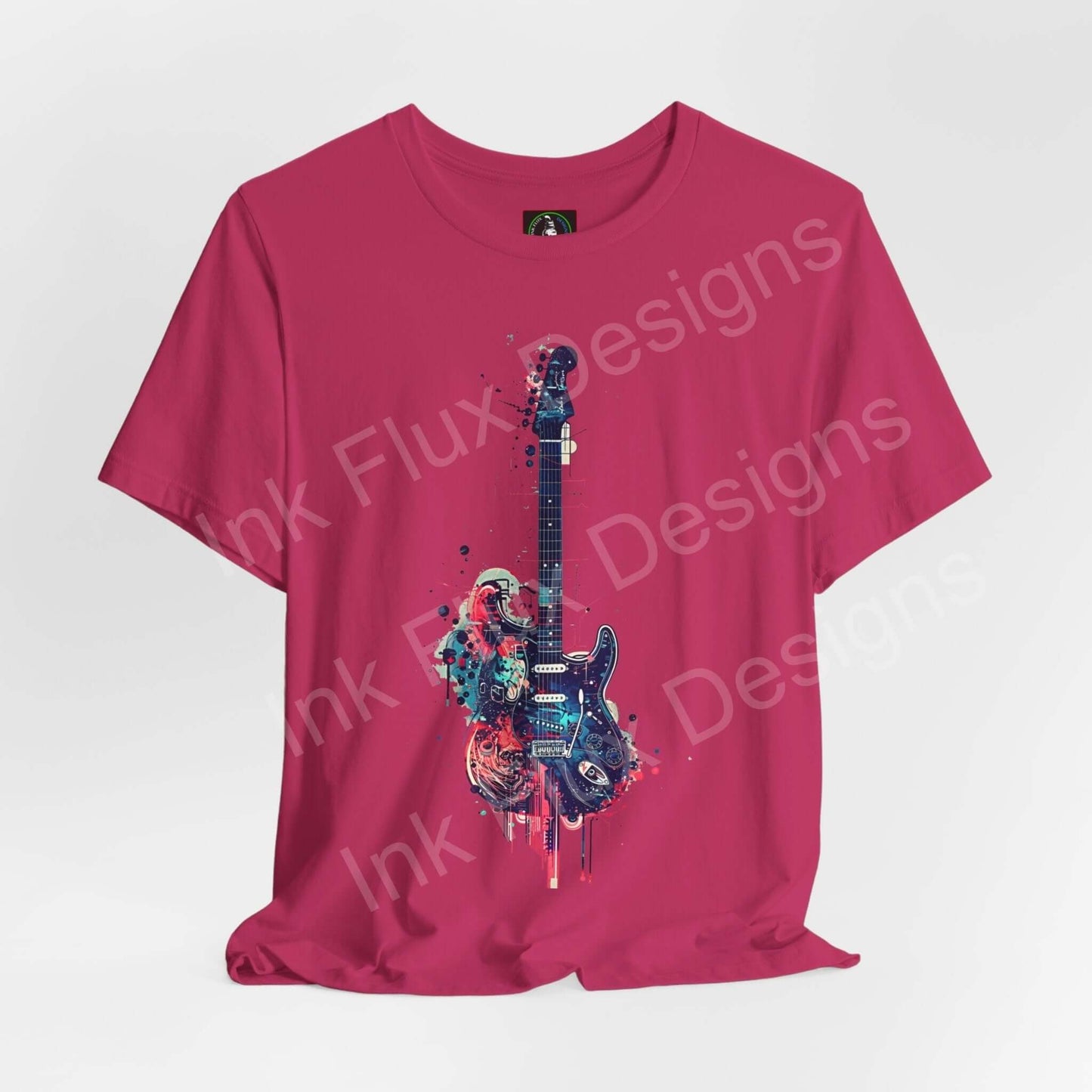 Bold graphic tee featuring a vibrant paint-splattered guitar design on a pink unisex jersey T-shirt, showcasing a casual yet stylish look.