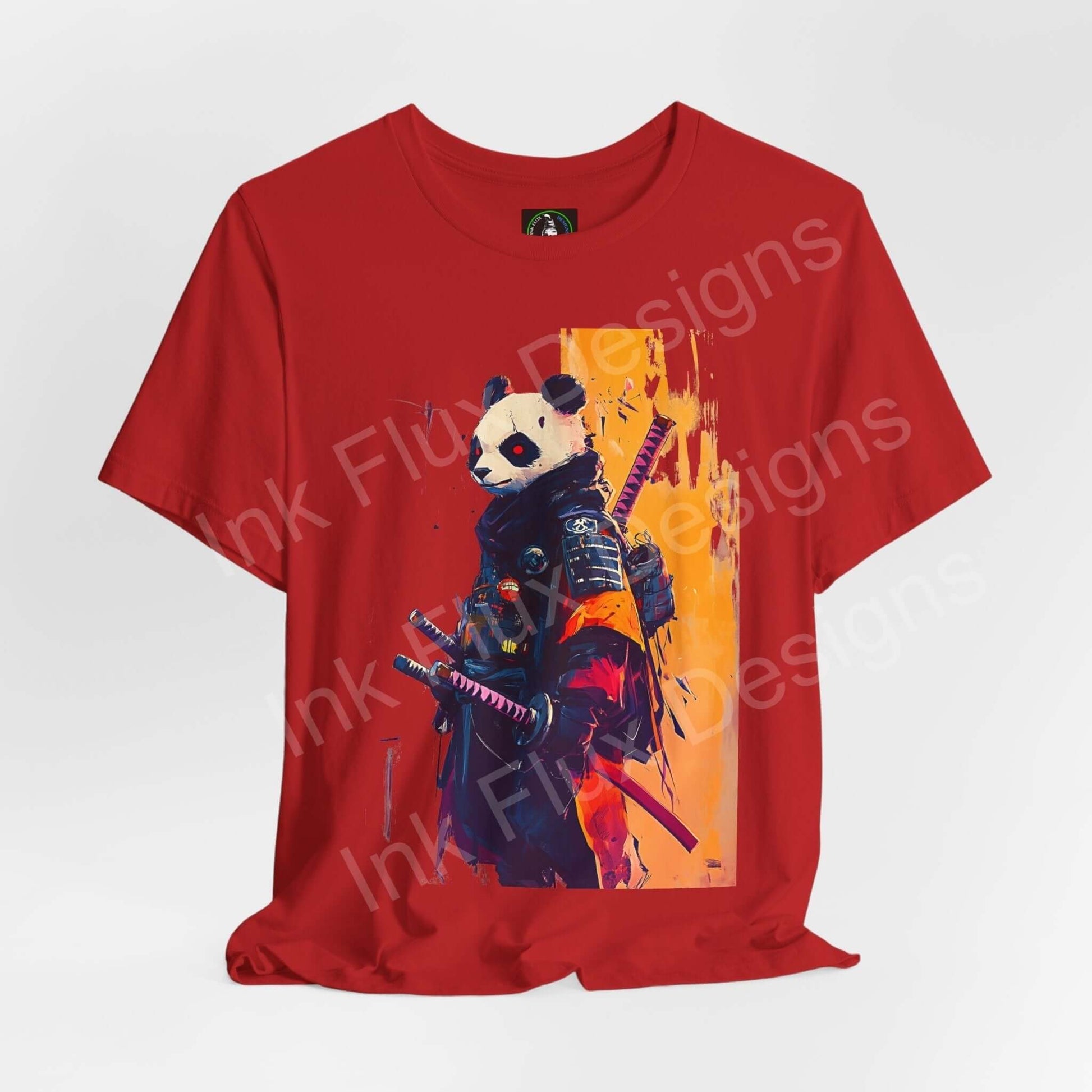 Red T-shirt featuring a graphic design of a panda dressed as a samurai with dual swords, from the Panda Samurai line by Bella+Canvas.
