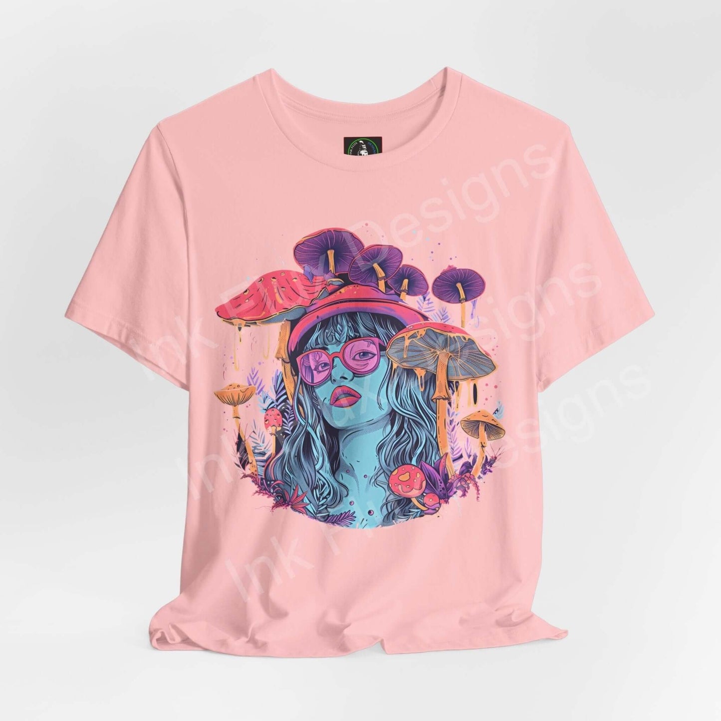 Pink psychedelic graphic tee featuring a trippy mushroom and female face design, made from sustainable Airlume cotton.