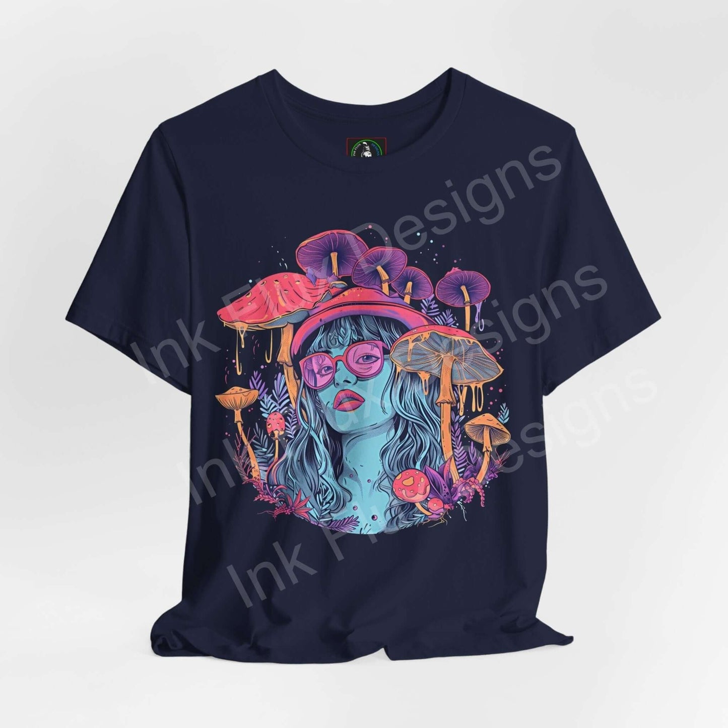 Navy blue unisex T-shirt featuring a bold psychedelic graphic with vibrant mushrooms and a stylized female face in glasses, from Bella+Canvas.