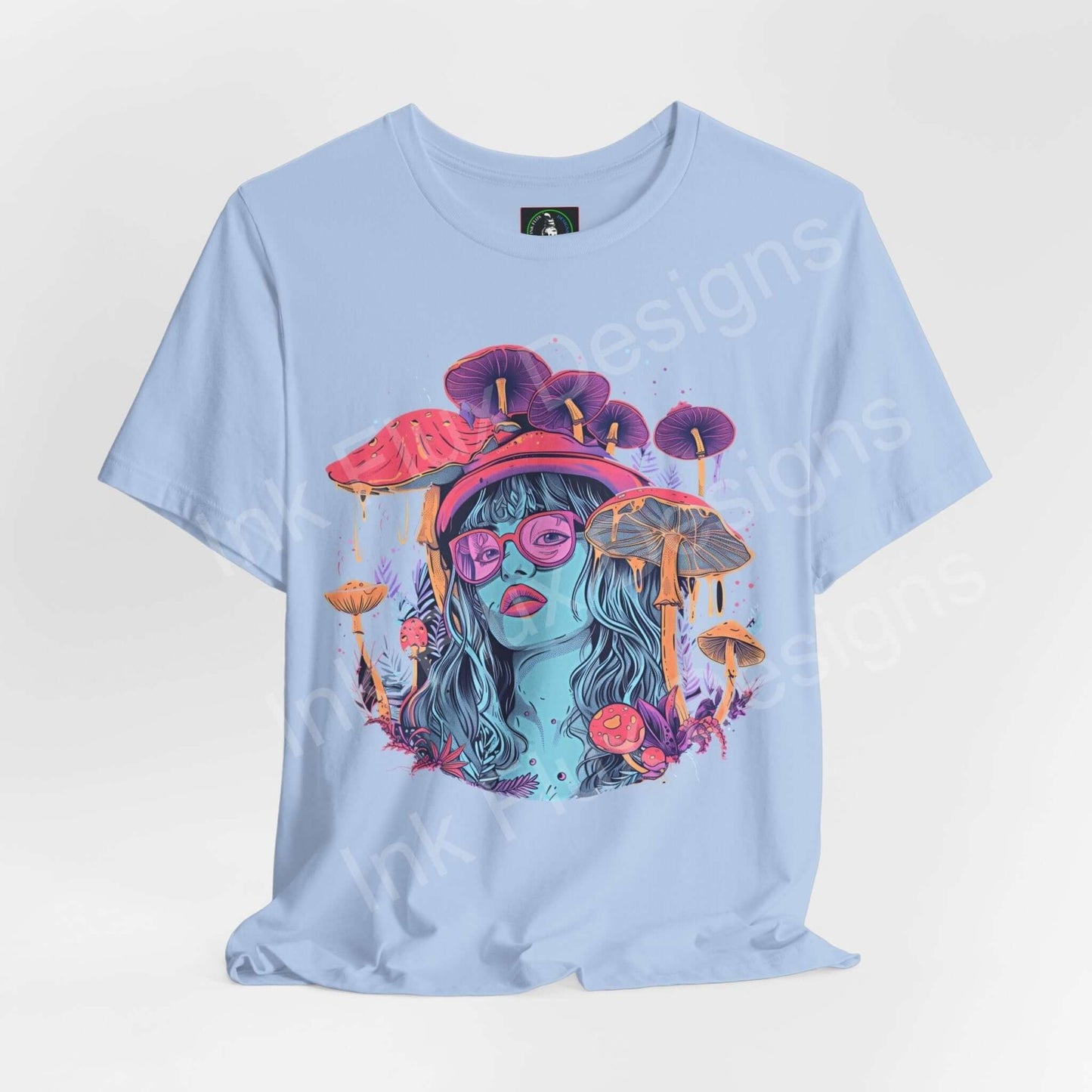 Light blue unisex T-shirt featuring bold psychedelic graphic of a woman with mushroom motifs in vibrant colors, ideal for fans of trippy, visually impactful apparel.