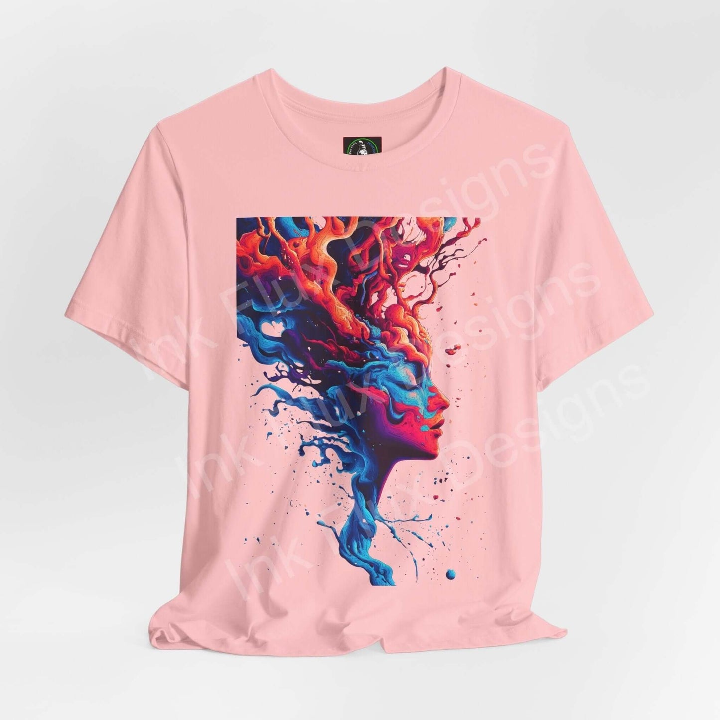 Pink unisex T-shirt featuring a vibrant, psychedelic graphic of a colorful abstract face, ideal for those who love bold trippy tees.