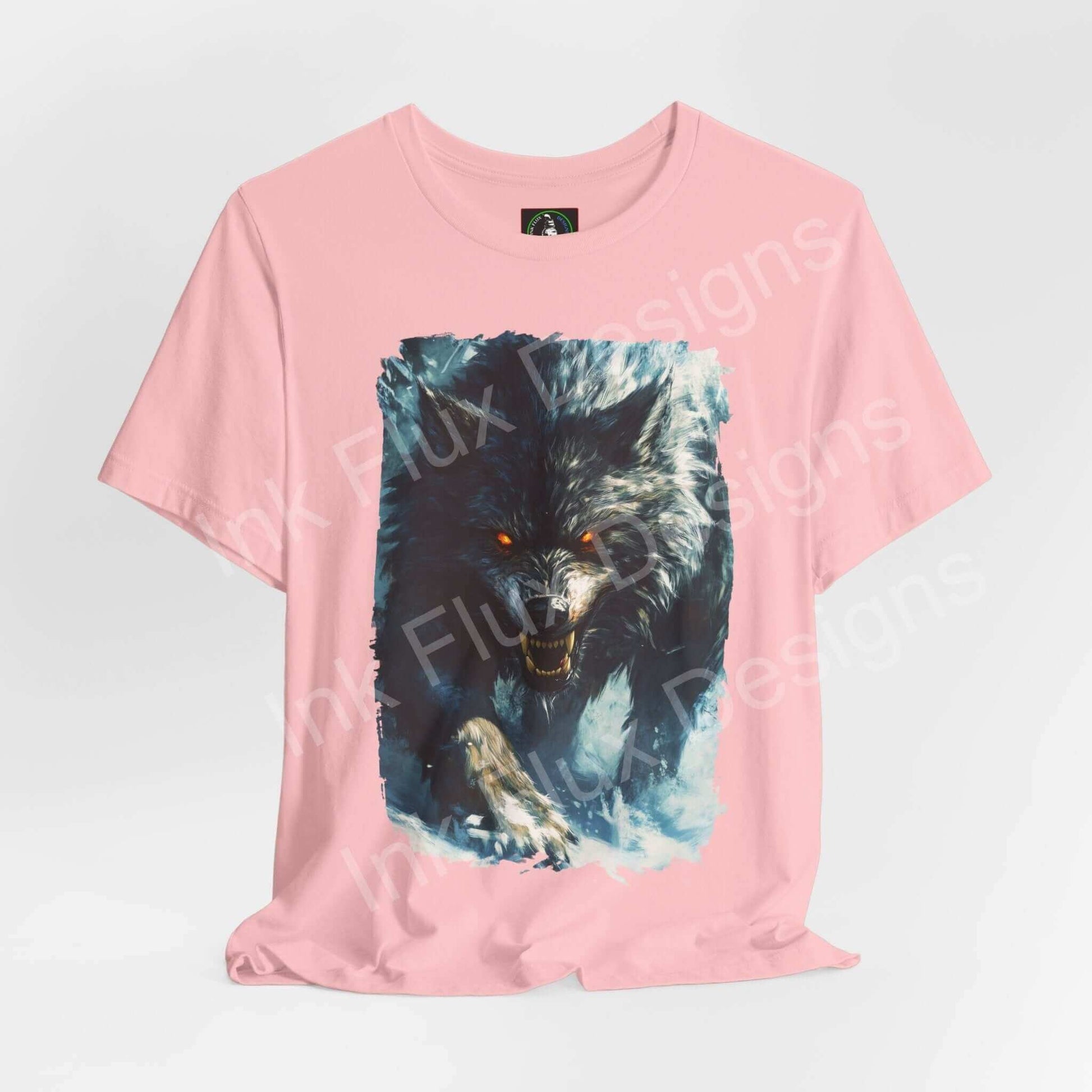 Pink unisex T-shirt featuring a fierce grey wolf graphic, ideal for fans of spirit animals and ethically made graphic tees.