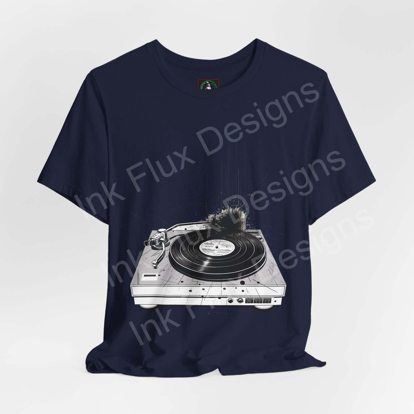 Navy unisex jersey T-shirt with bold graphic of a record player, crafted for comfort and style by Bella+Canvas.