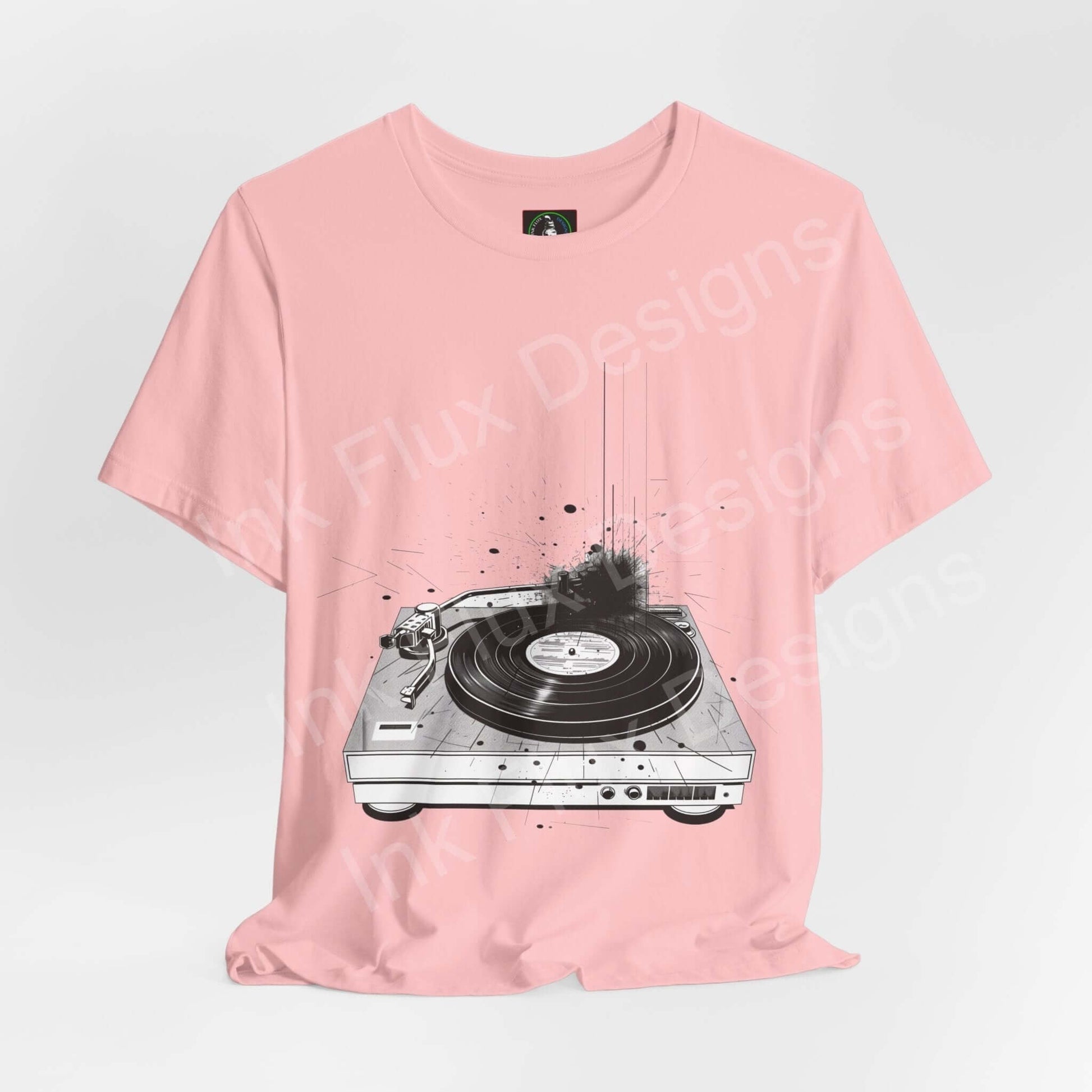 Pink unisex T-shirt featuring bold graphic of a record player, from Bella+Canvas, ideal for casual wear.
