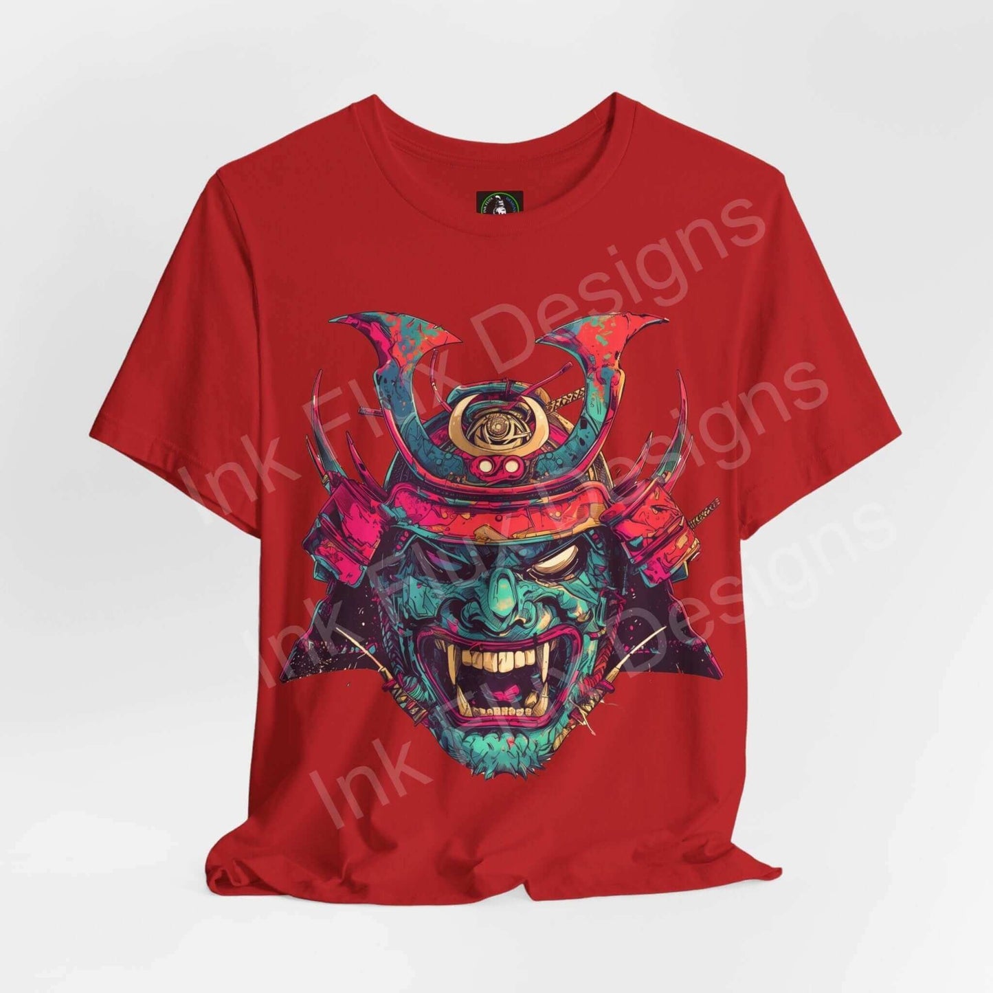 Red unisex T-shirt featuring a bold graphic of a colorful Samurai mask, crafted from lightweight Airlume cotton by Bella+Canvas.