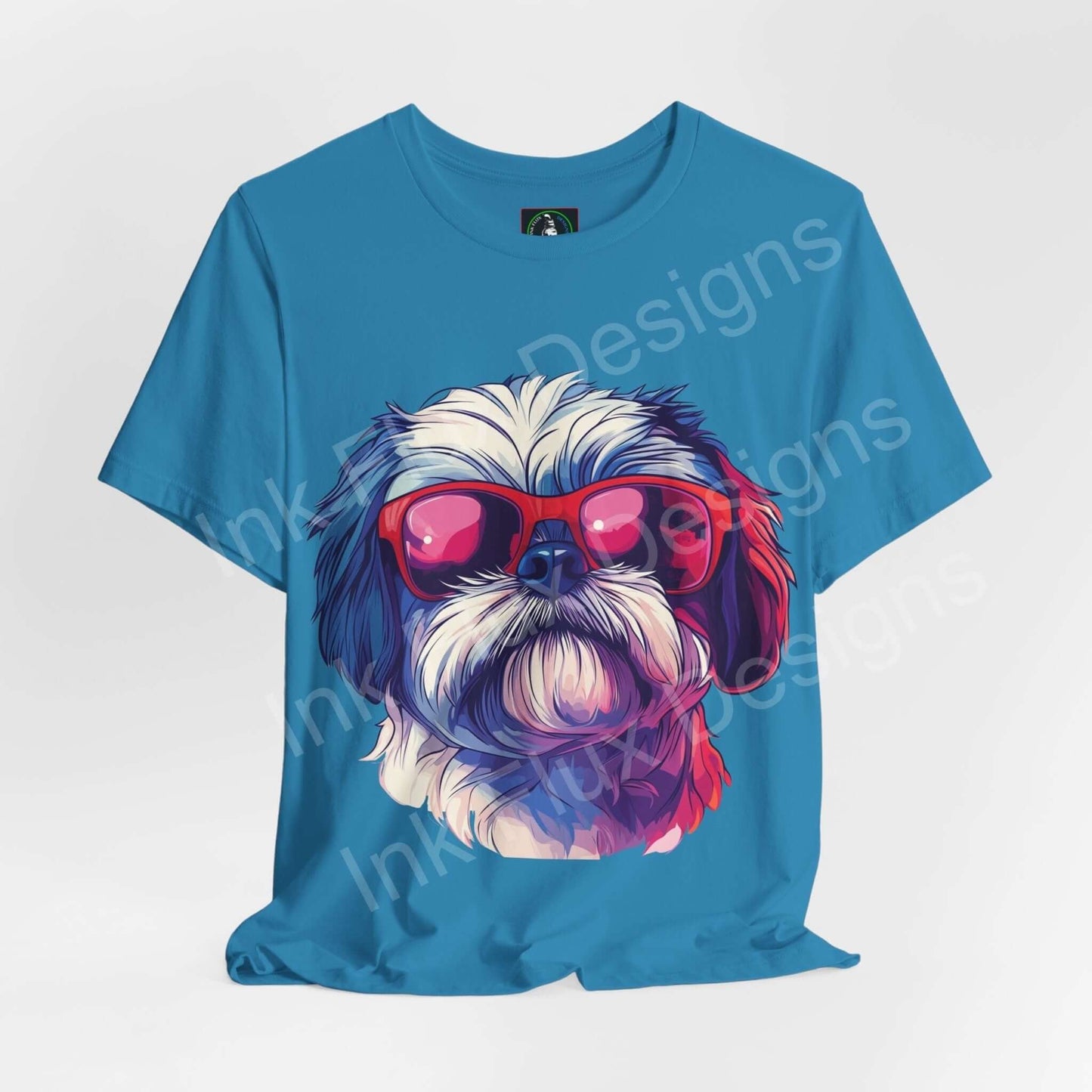 Blue graphic tee featuring a Shih Tzu wearing red sunglasses, designed for comfort and style, from Bella+Canvas