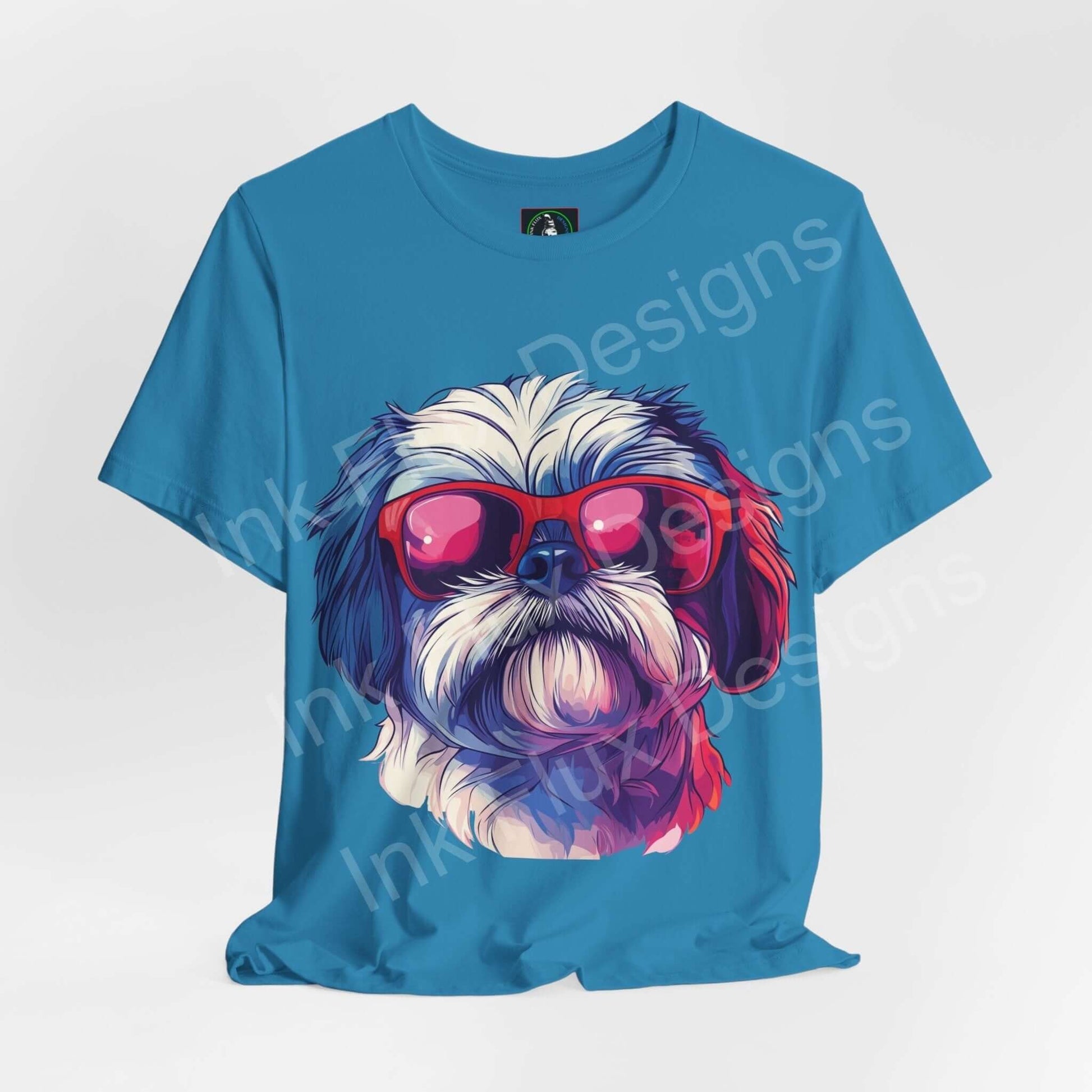 Blue graphic tee featuring a Shih Tzu wearing red sunglasses, designed for comfort and style, from Bella+Canvas
