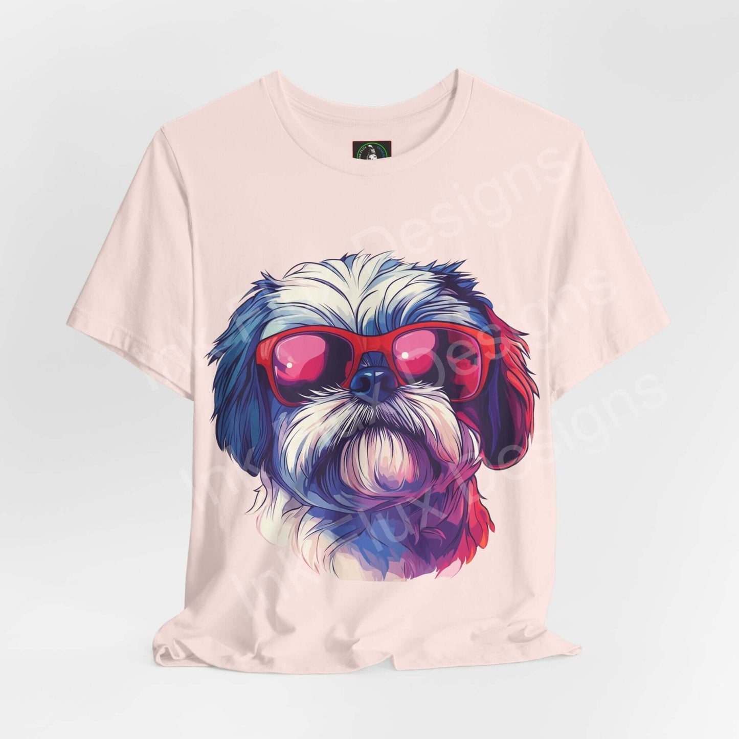 Stylish pale pink T-shirt featuring a colorful graphic of a Shih Tzu wearing red sunglasses, perfect for dog lovers and casual wear.