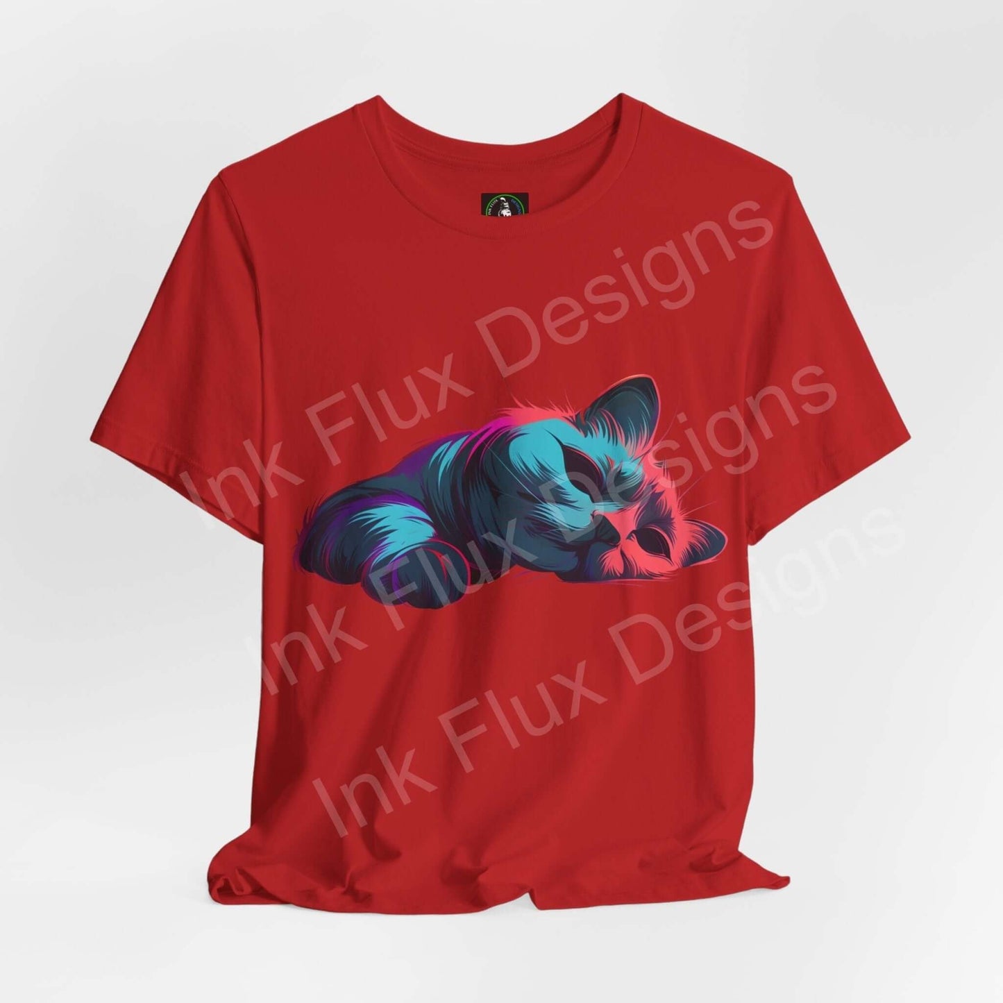 Unisex red T-shirt featuring a vibrant graphic of a sleeping cat, crafted from soft Airlume cotton, by Bella+Canvas.