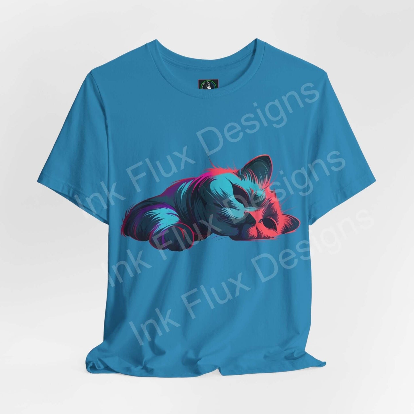 Blue unisex T-shirt featuring a vibrant, multicolored graphic of a sleeping cat, from Bella+Canvas sustainable and ethically made apparel line.