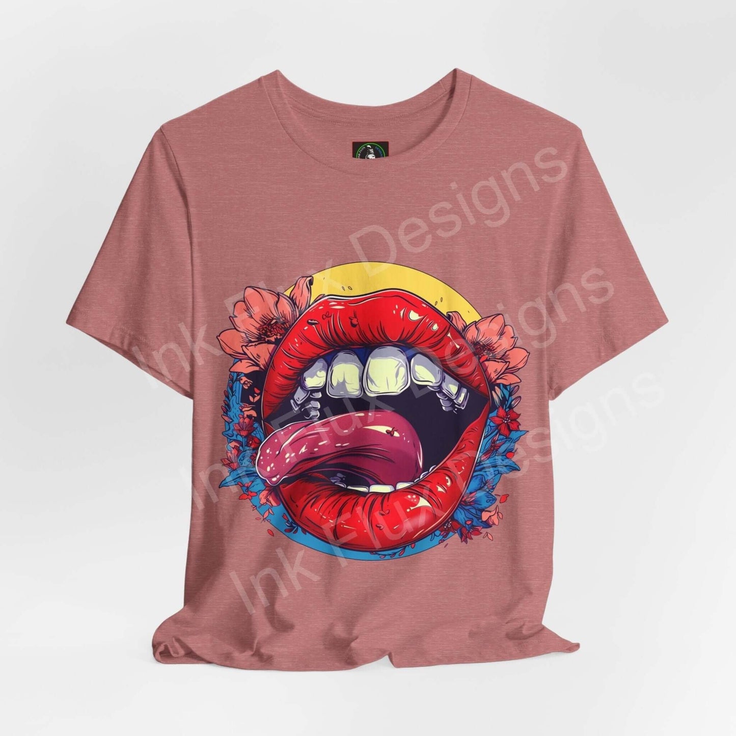Unisex rose-colored T-shirt featuring a bold graphic of a mouth with red lips, yellow background, and blue floral accents.