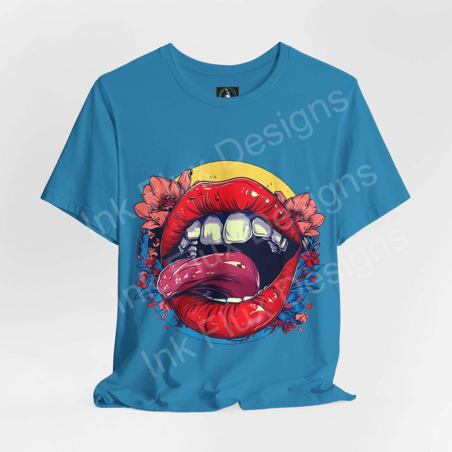 Bold graphic tee featuring a vibrant lips design with floral accents on a blue jersey T-shirt, ideal for stylish, casual wear.