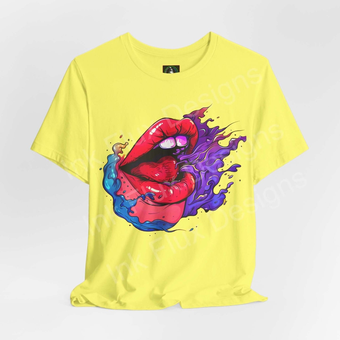 Yellow unisex T-shirt featuring a bold graphic of red lips and swirling colors, made from soft Airlume cotton by Bella+Canvas.